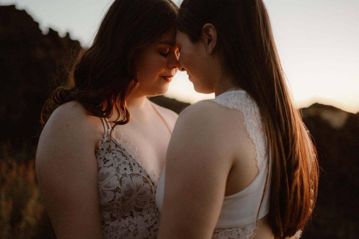 Couple touching foreheads with their eyes closed in a soft light