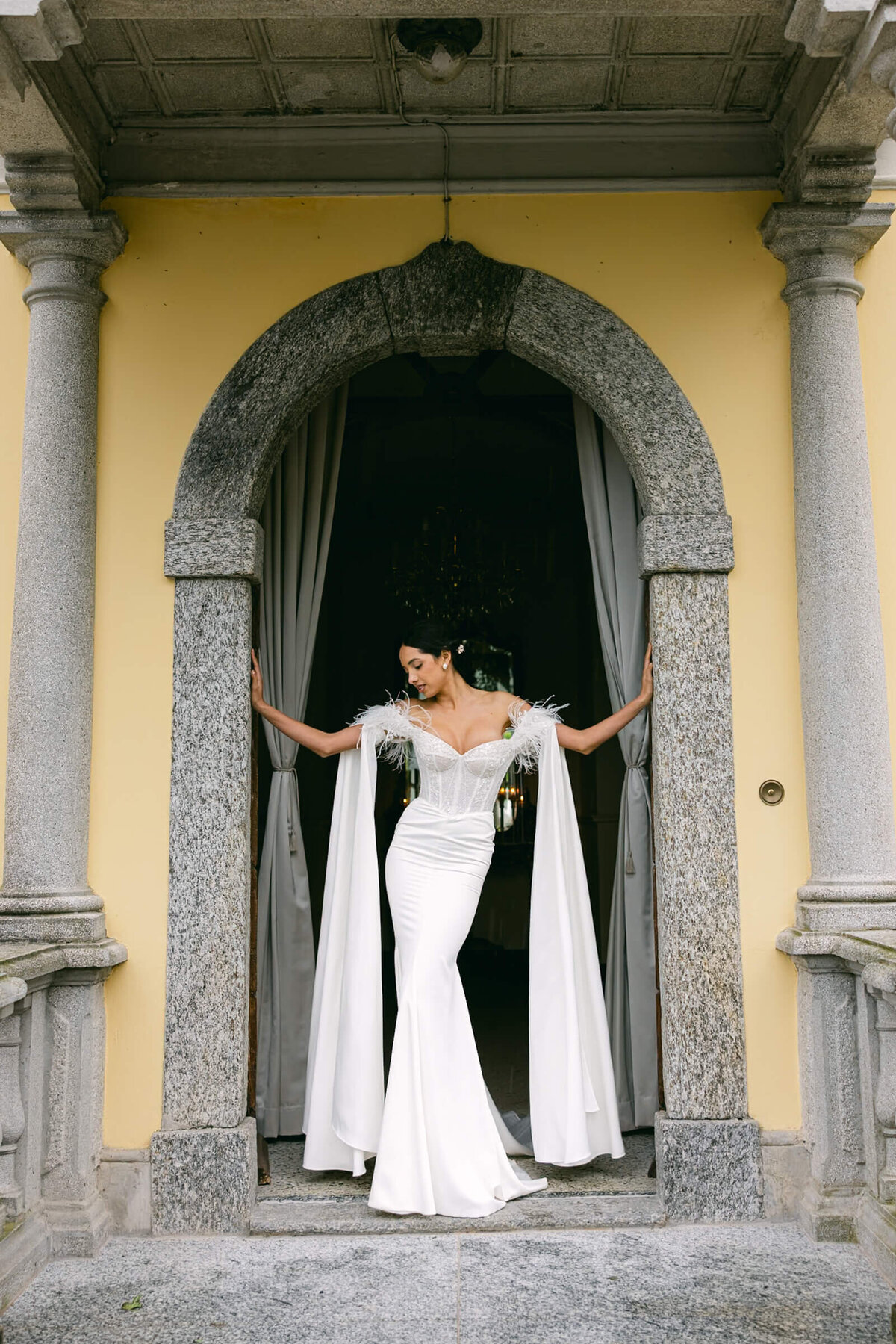 A wedding day bridal shot of a bride in her white dress at Villa Aura del Lago on lake como in Italy