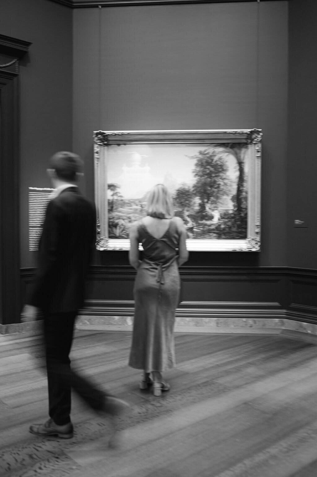 Motion blur image of a couple in a museum