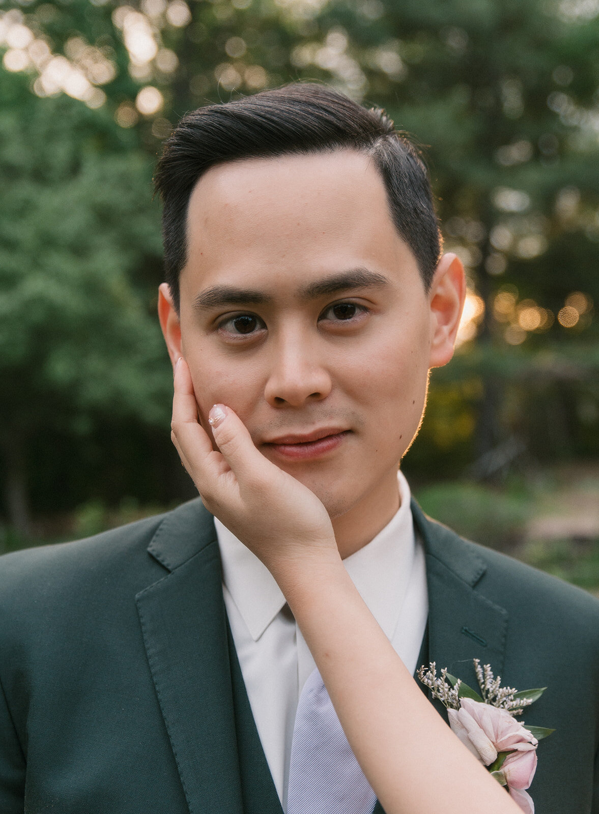 bride-holding-grooms-face-romantic-wedding-jemima-richards-photography