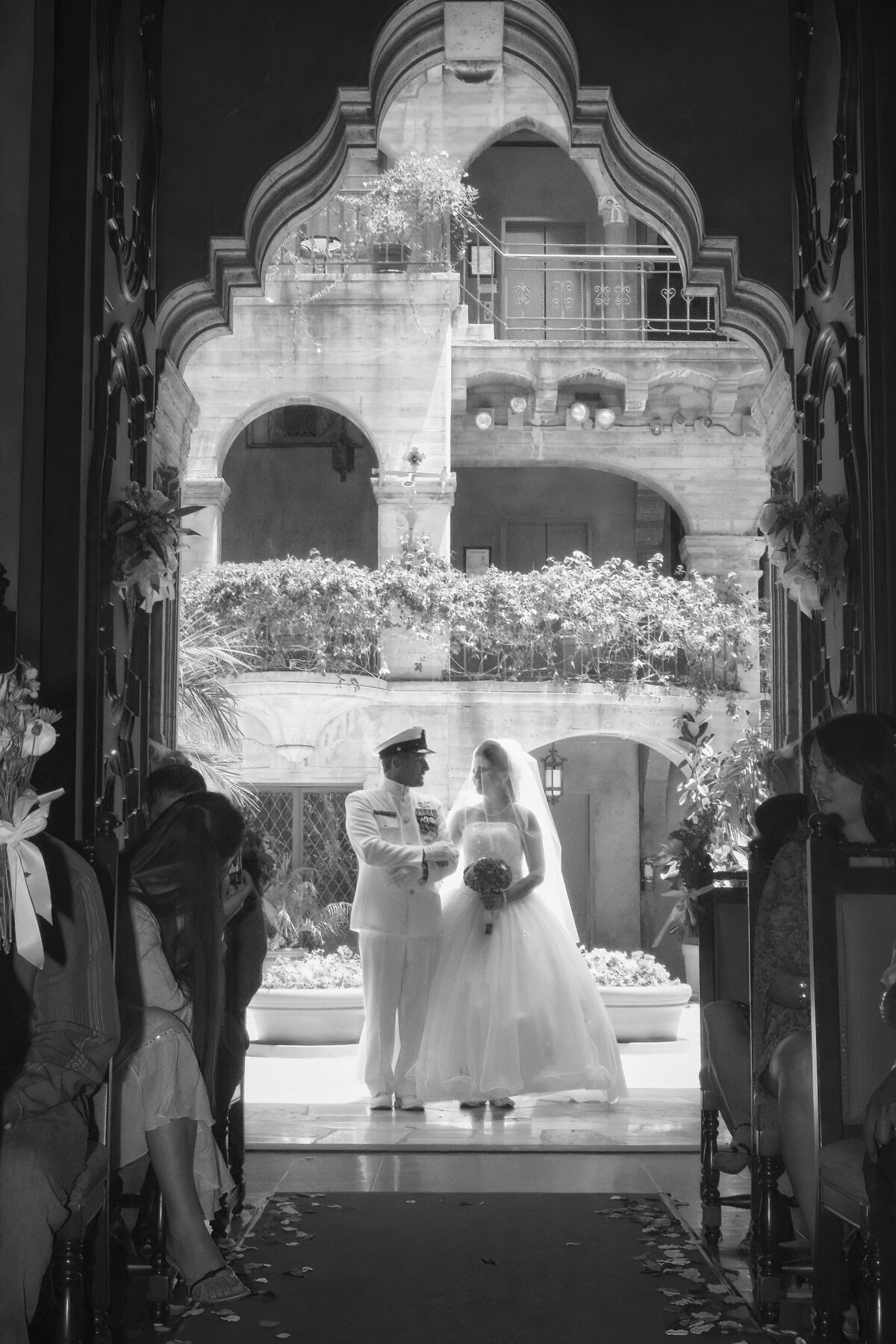 Bride enters wedding chapel with elaborate doorway