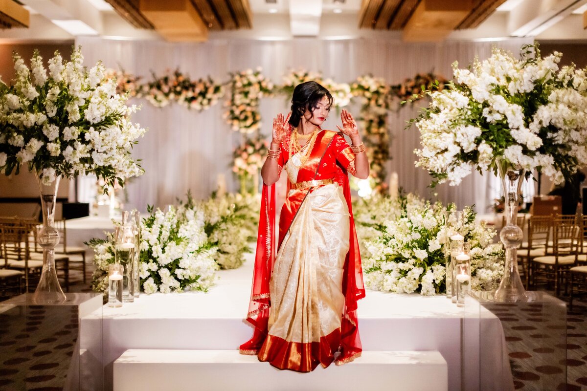 Indian Bride in front of beautiful mandap before first look and ceremony