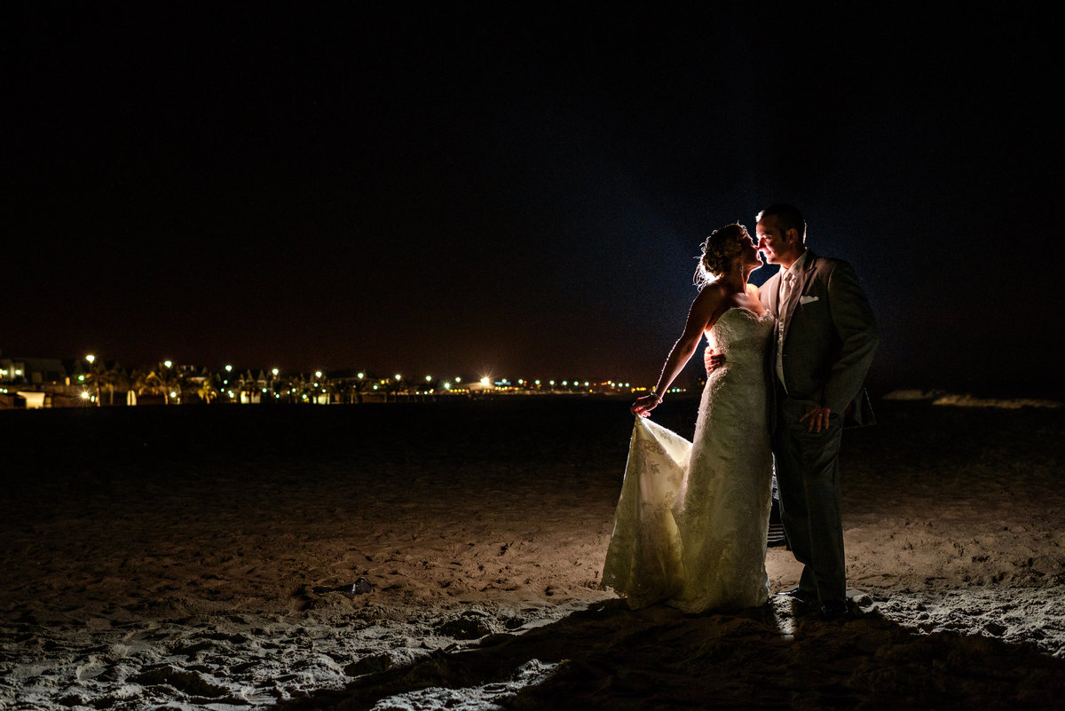 A wedding couple pose for a night portrait after their long branch, NJ wedding.