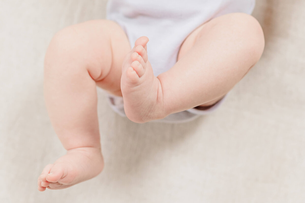 Close up image of a Boston newborn's tiny feet