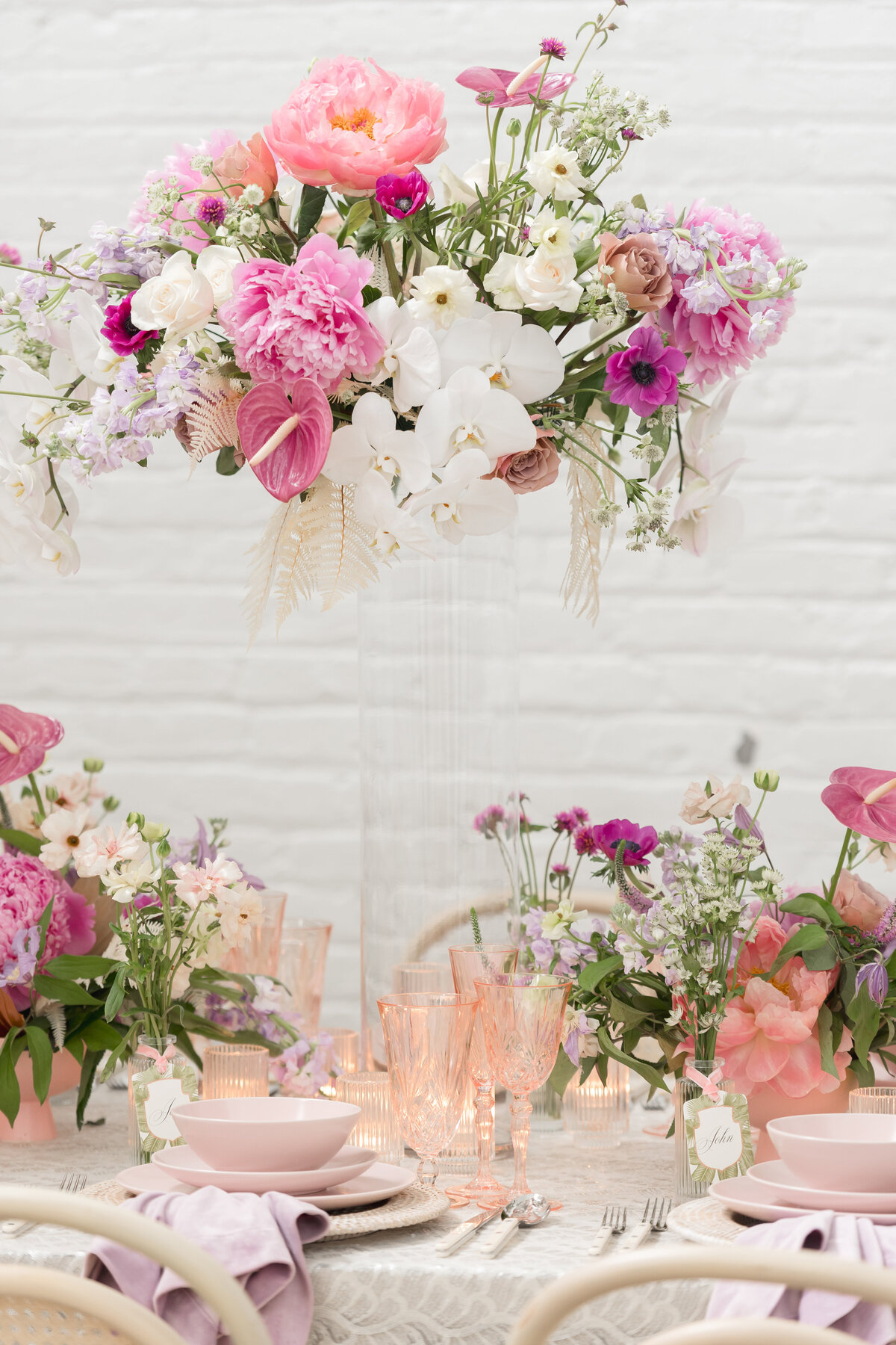 reception detail of a table scrape with two tall center pieces