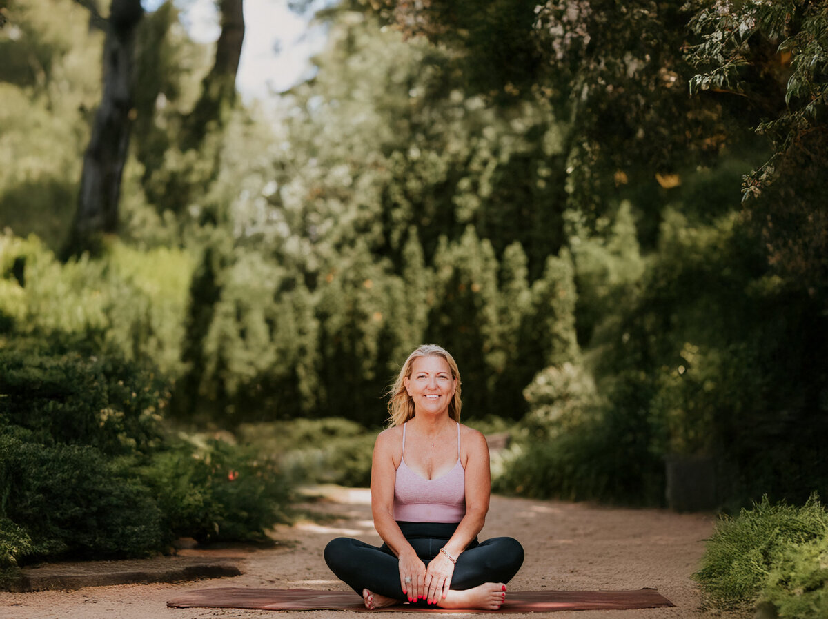 Close-up portrait of Amy Witte, founder of Inhale/Exhale Yoga, embodying calm strength and approachability.