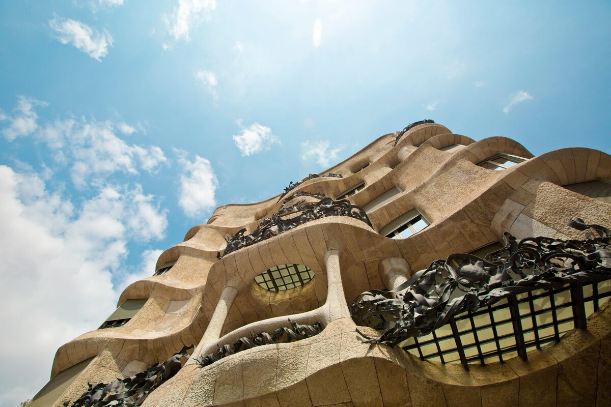 Gaudi Building in Barcelona from below with blue sky in the background