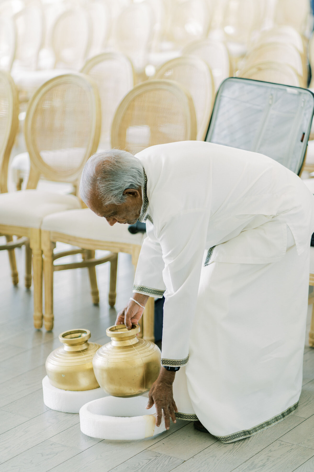 Priest setting up for indian wedding at the pearle hotel