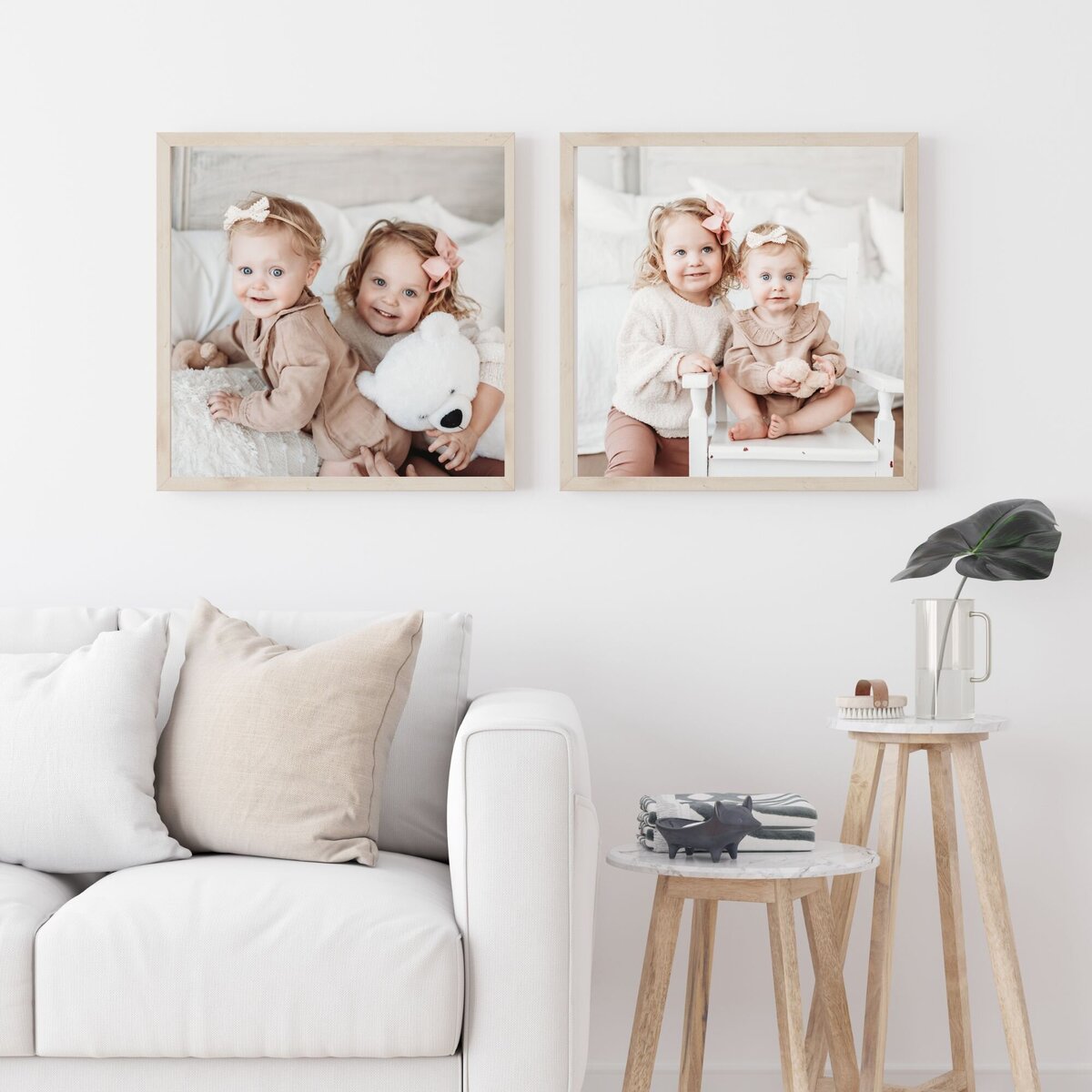 two framed images from milestone session hung in family room above couch