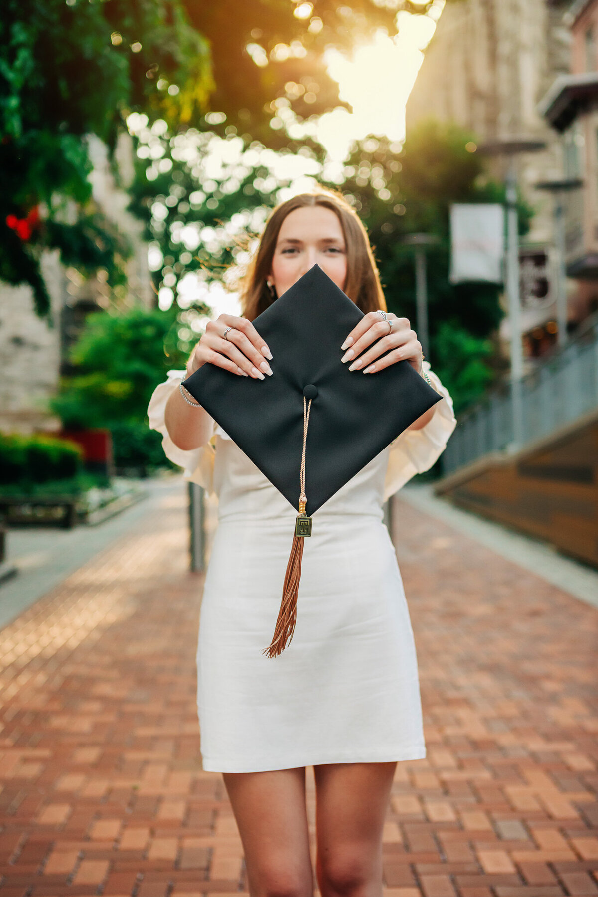 girl-holding-graduation-cap