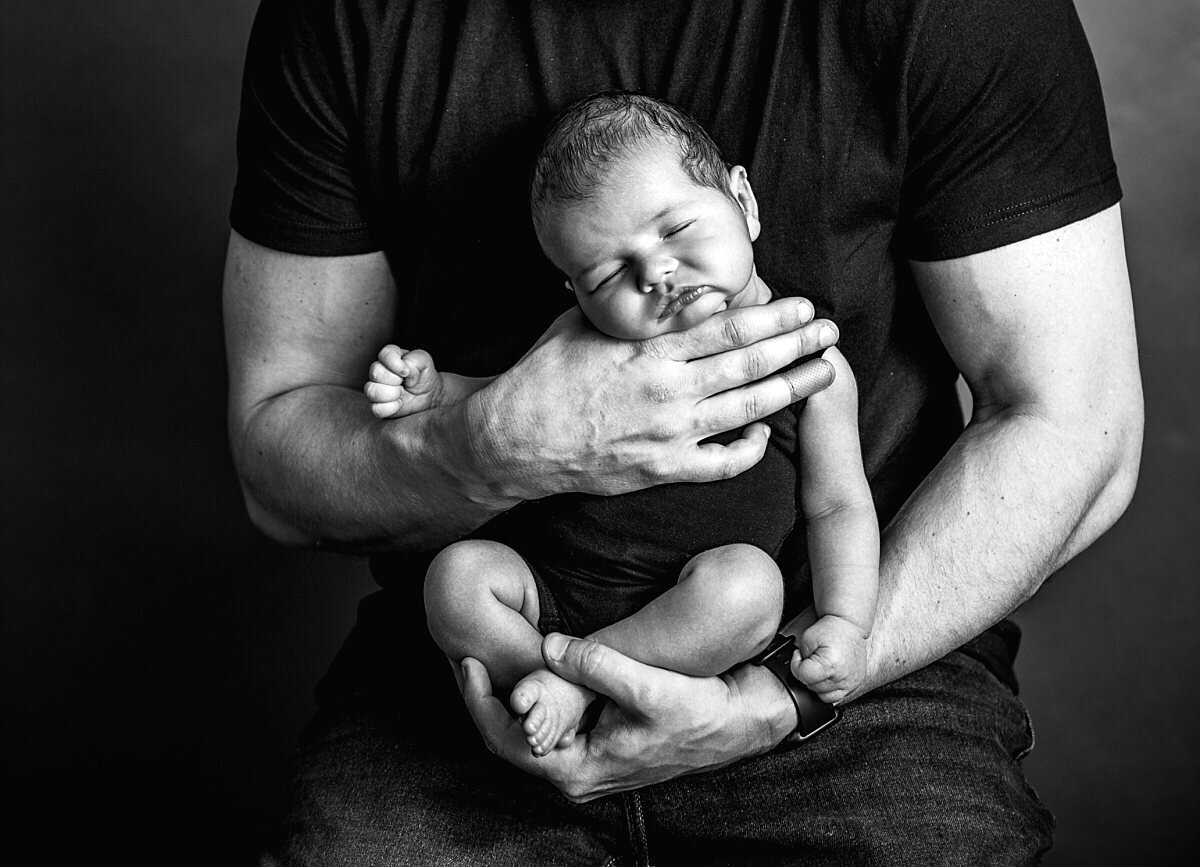 newborn-boy-in-dads-arms