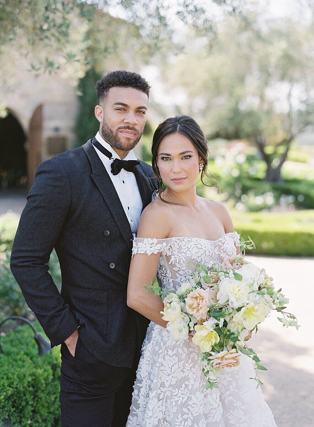 bride and groom in front of cal-a-vie wedding chapel  | Jacqueline Benét