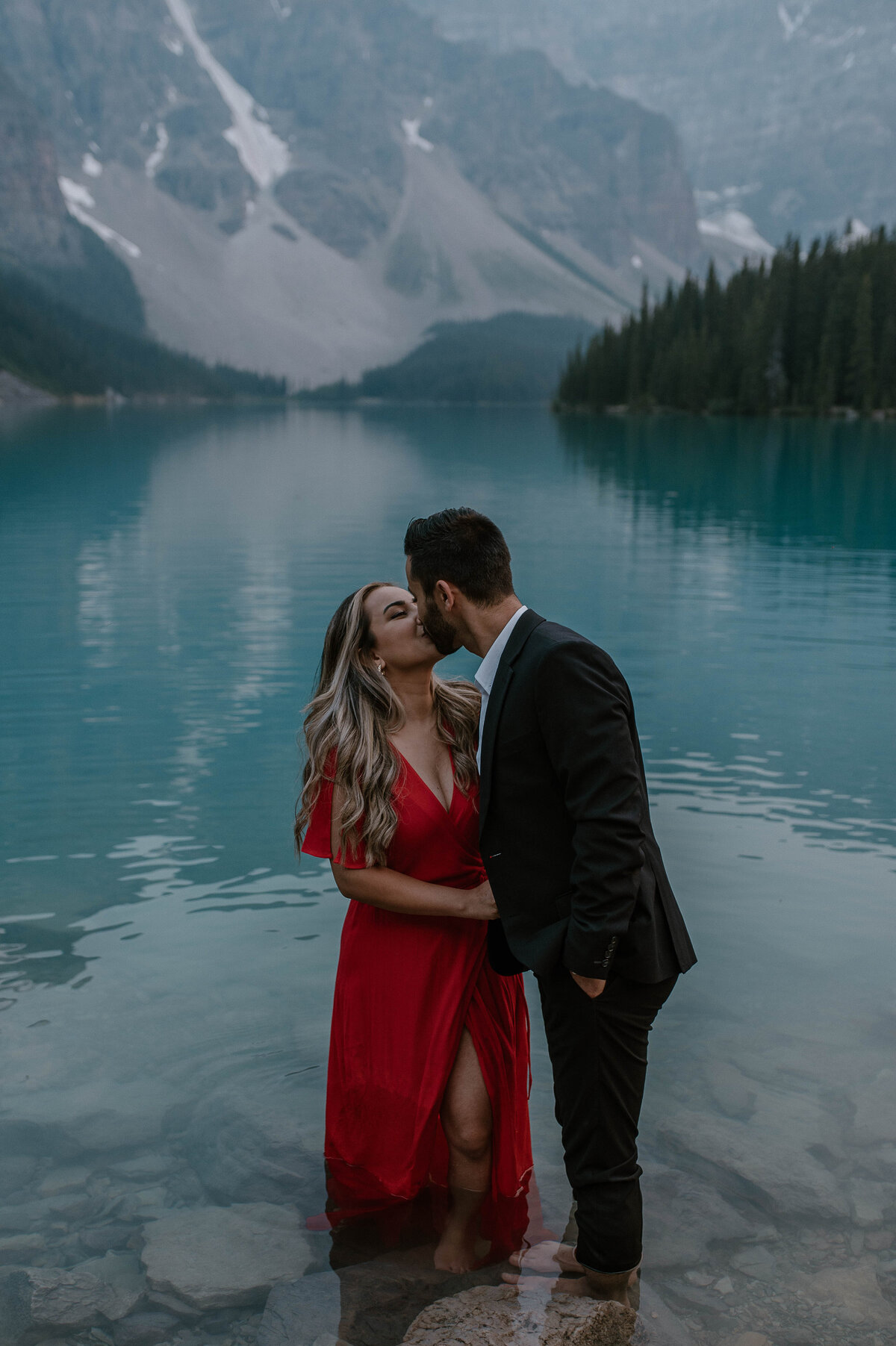 couple standing in moraine lake