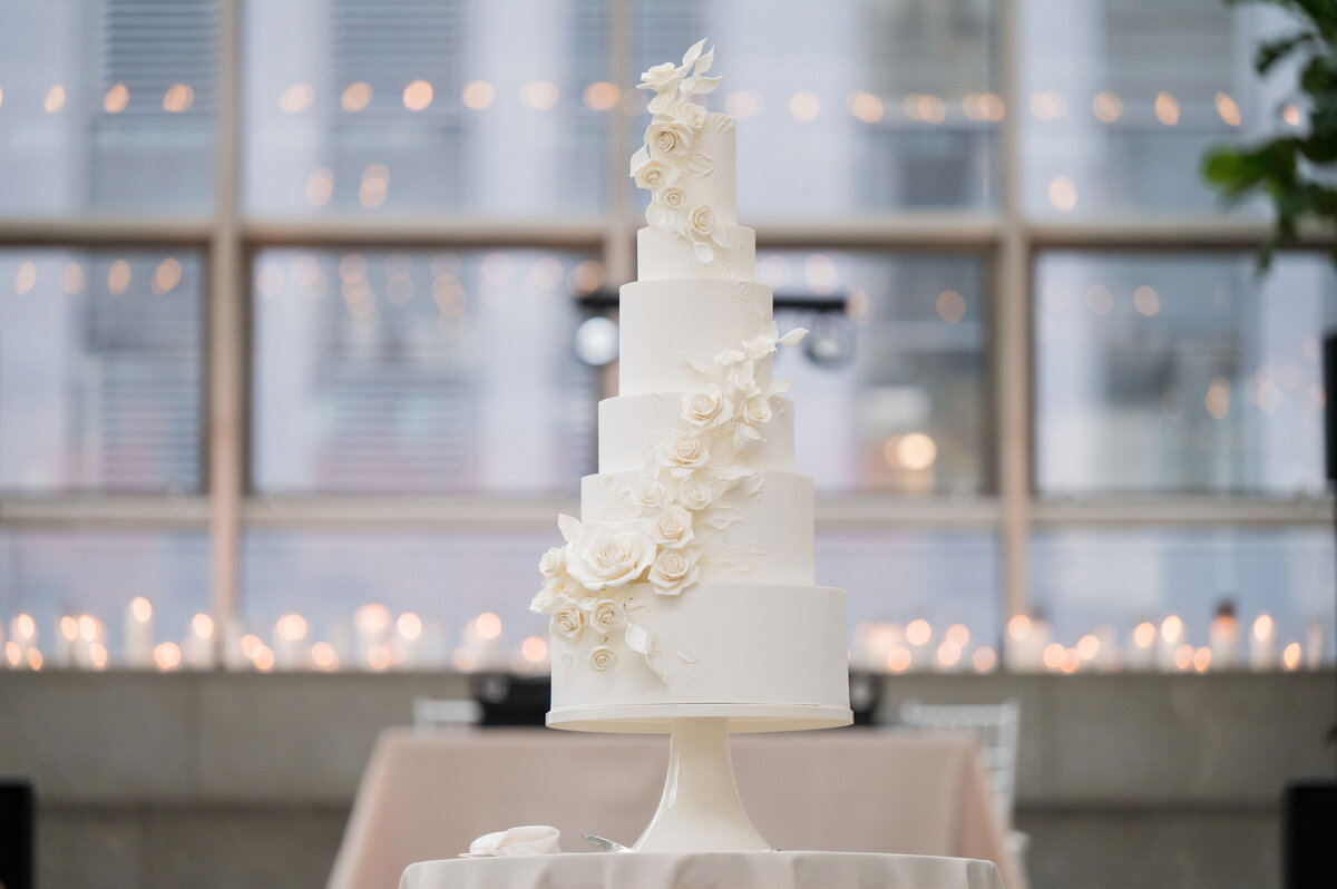 wedding cake white with flowers made by pittsburgh baker tasty bakery
