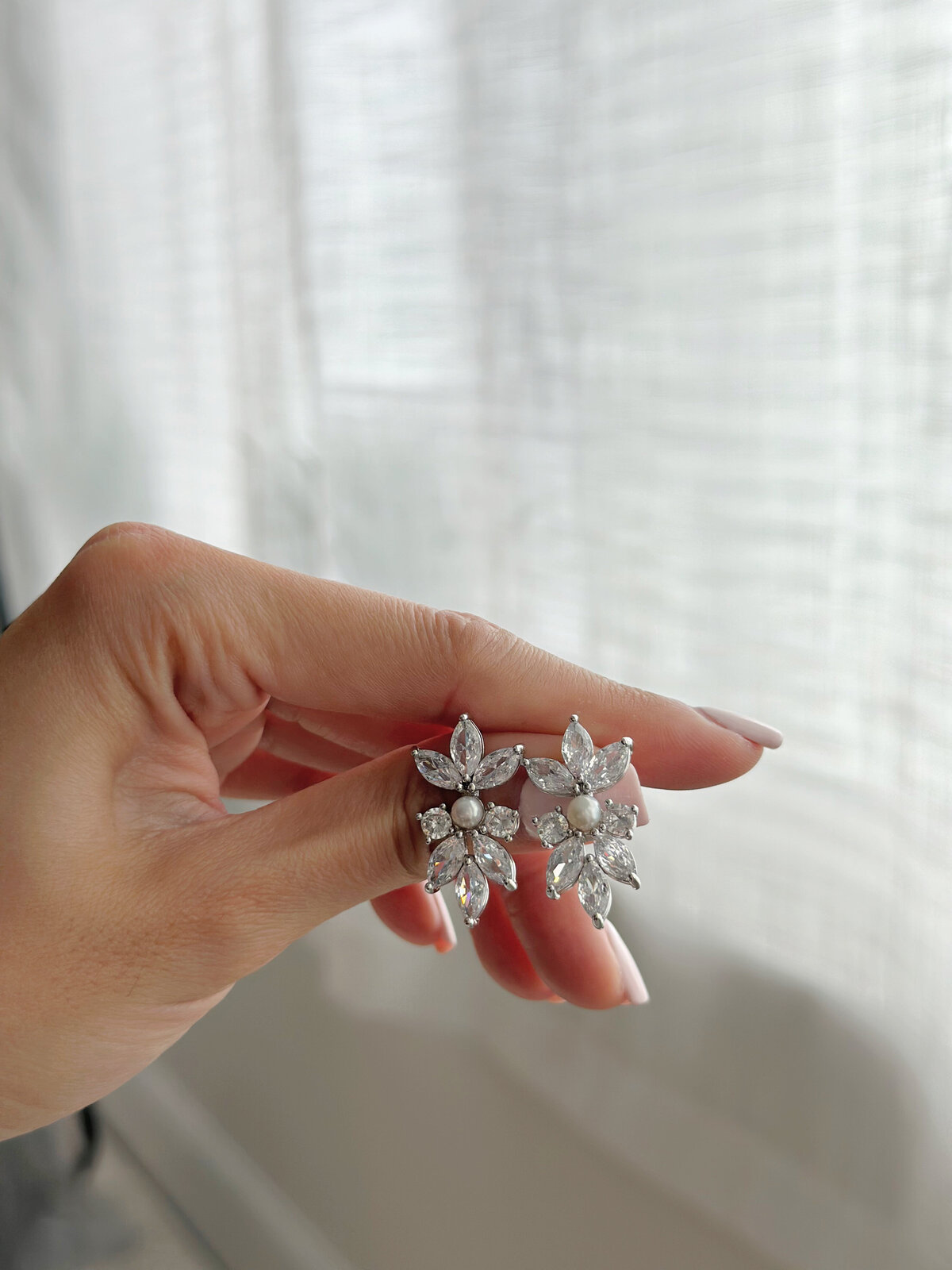 Bride styled with elegant pearl and crystal jewelry set
