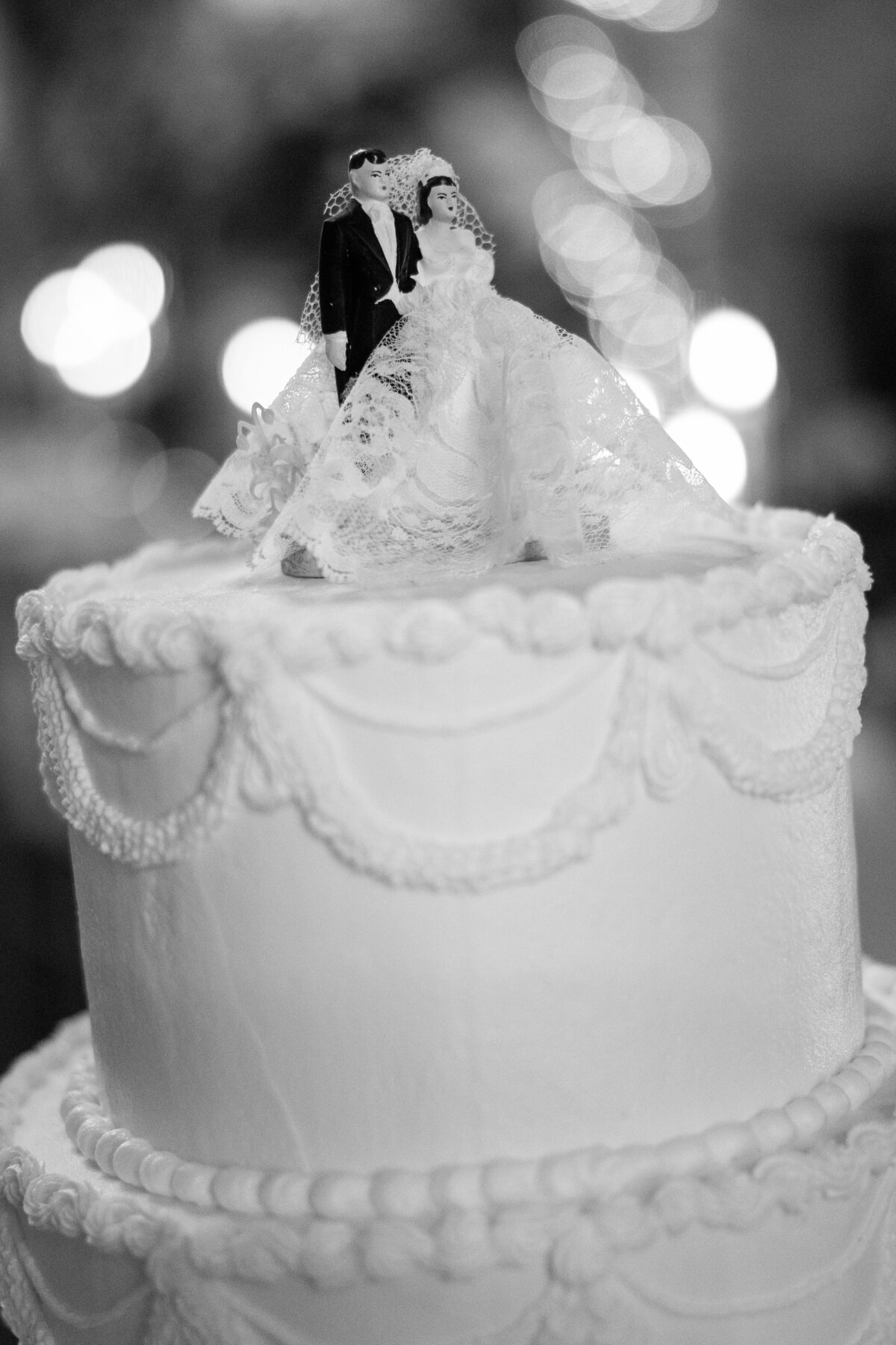 Wedding cake with vintage piping and cake topper