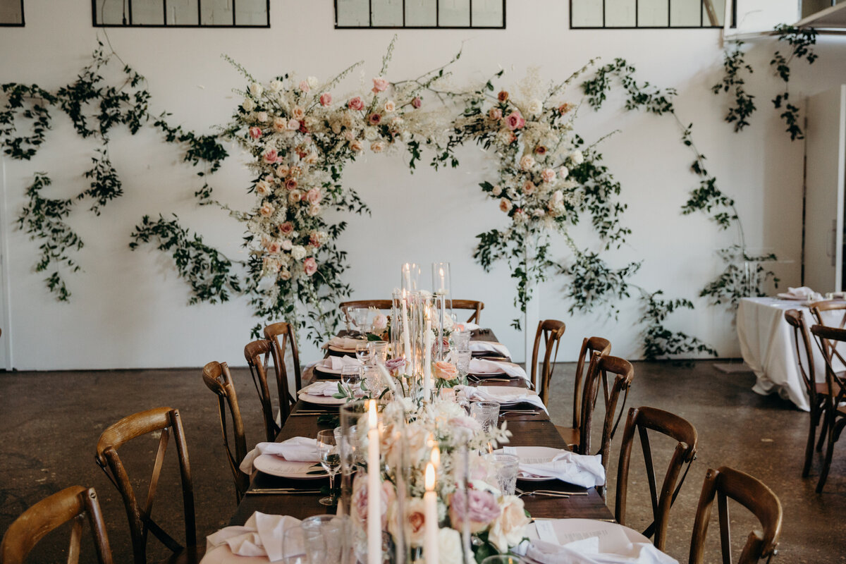 Industrial loft wedding with rustic harvest table and ethereal flowers  at Airlship37 venue in Toronto