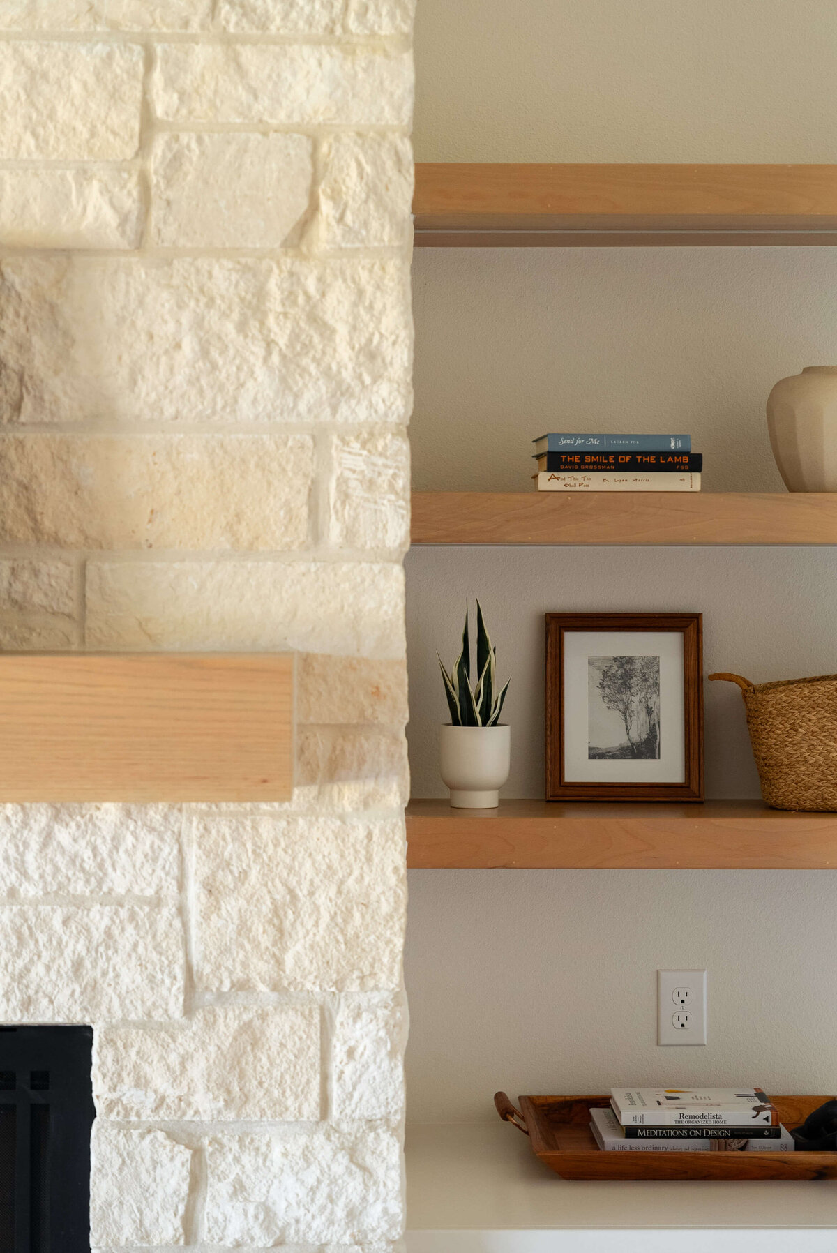 Stone fireplace with built-in shelves
