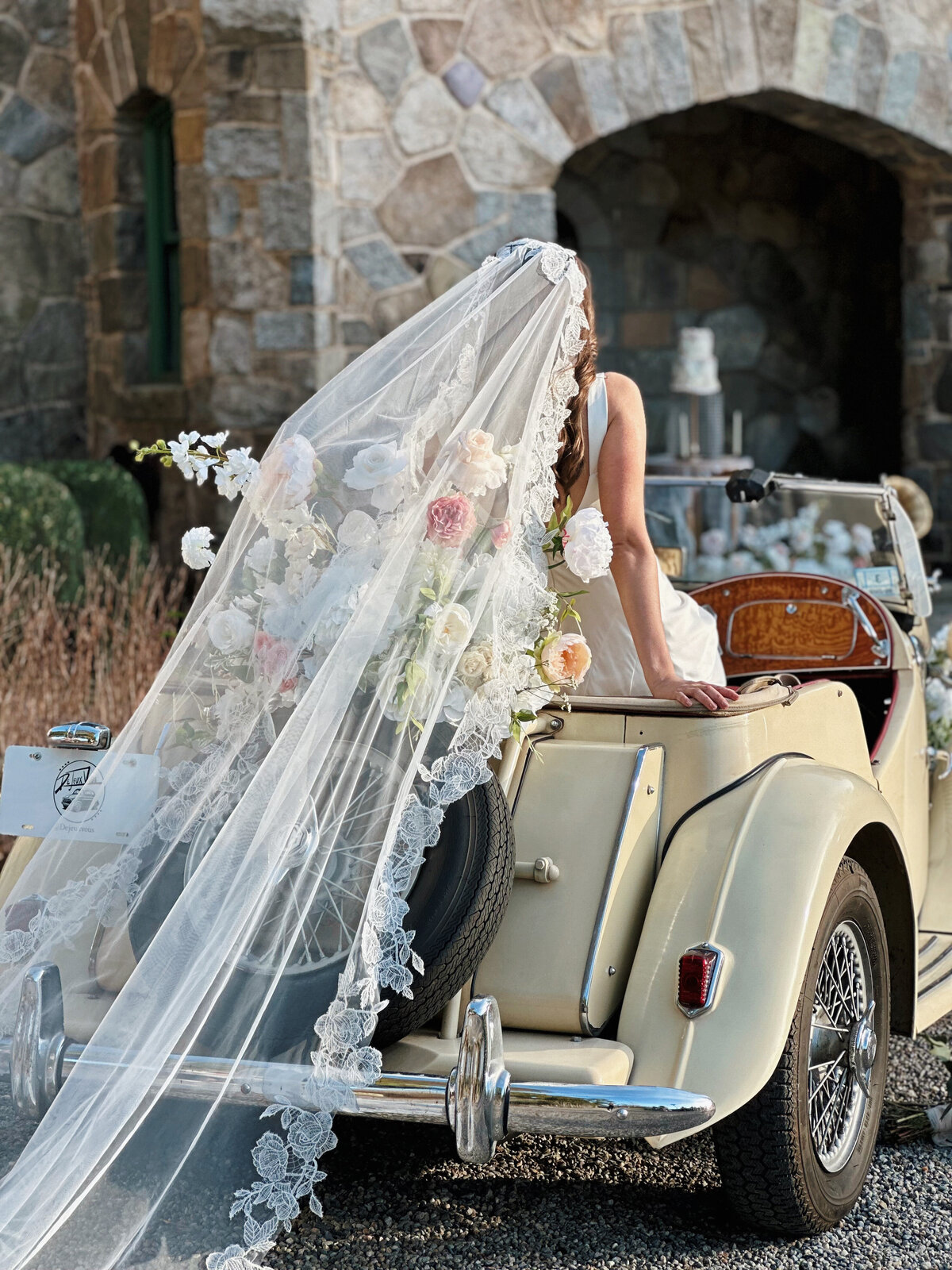 Romantic bridal portrait featuring handmade lace mantilla veil