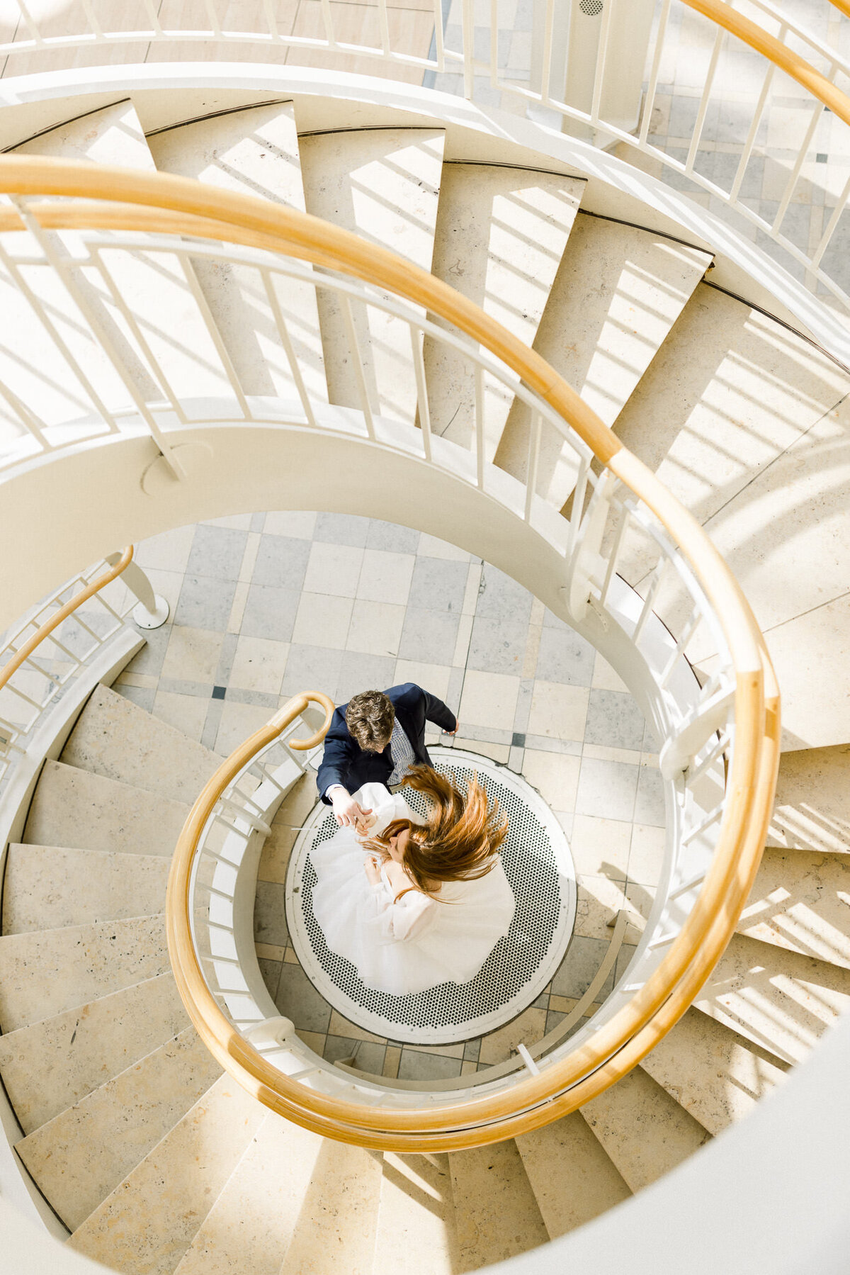 fernbank-wedding-photos-couple-twirling-spiral-staircase