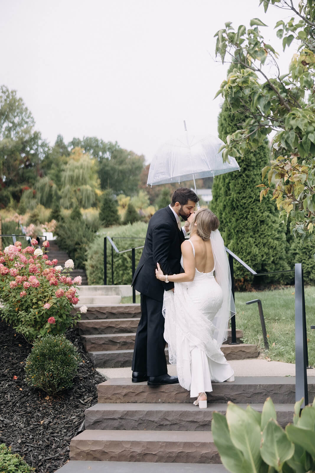Bride and groom walking up steps at  Finger Lakes Wedding, NY