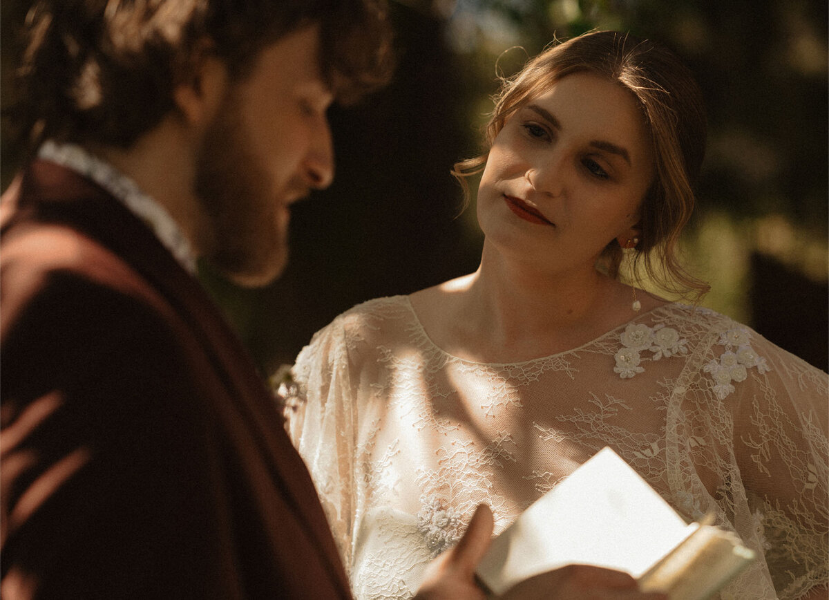 intimate and private elopement couple exchanges vows under green trees and amongst nature in Bend, Oregon