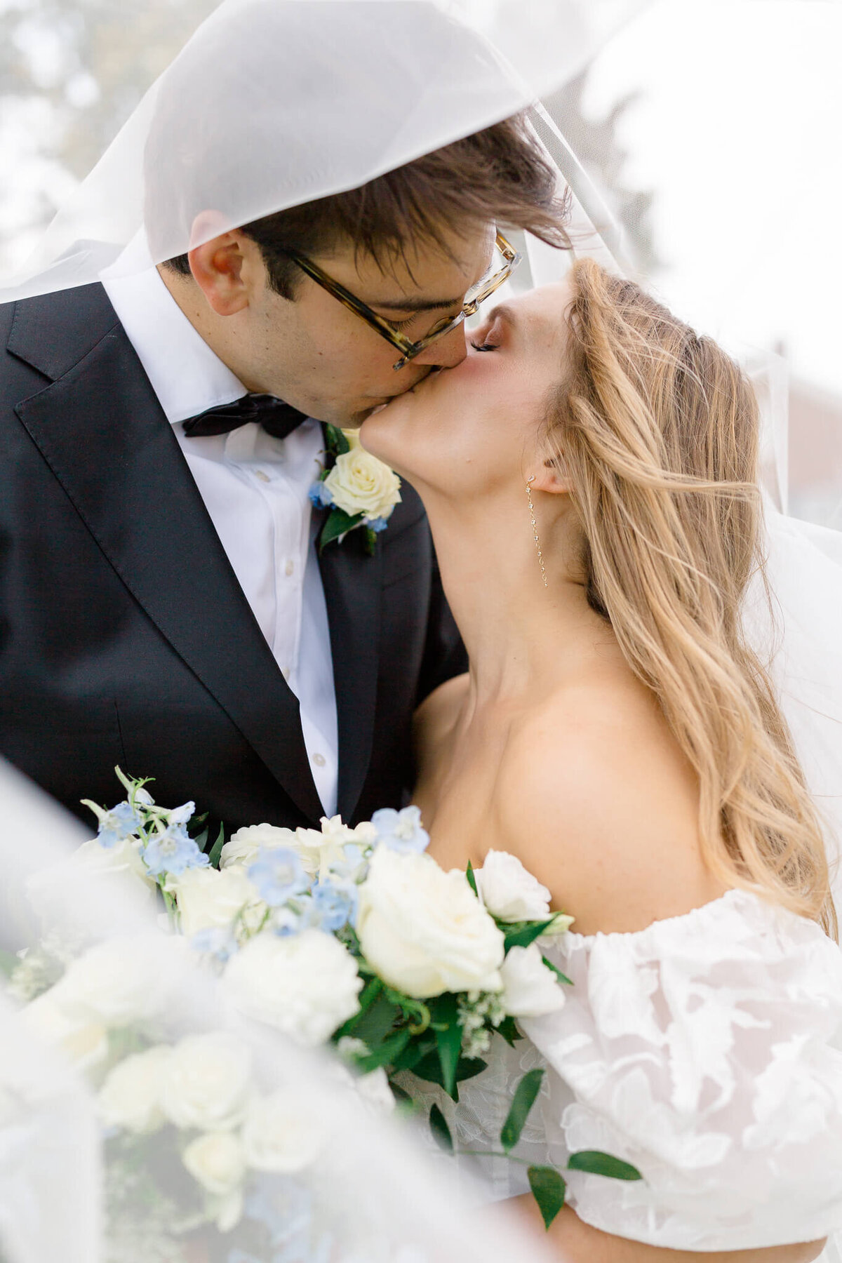 Bride and Groom kissing under veil. Taken by Washington DC Wedding Photographer Bethany Aubre Photography.