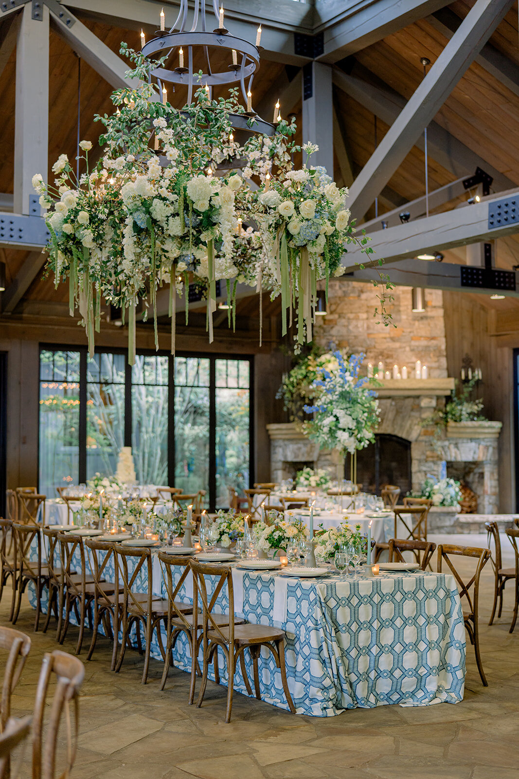 Suspended floral chandelier with cascading greenery, white roses, and hydrangeas at a luxury wedding reception at Old Edwards Inn in Highlands, North Carolina.