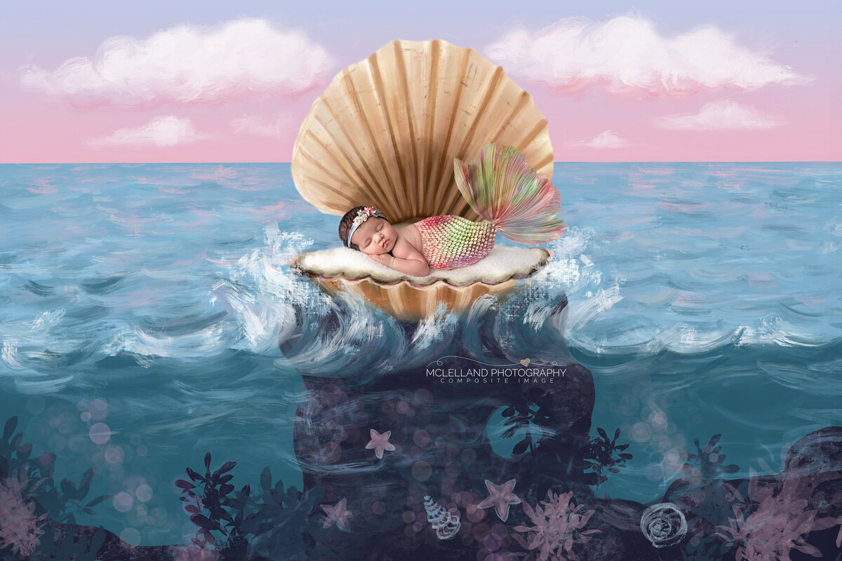 Newborn girl in a seashell prop with ocean-themed background