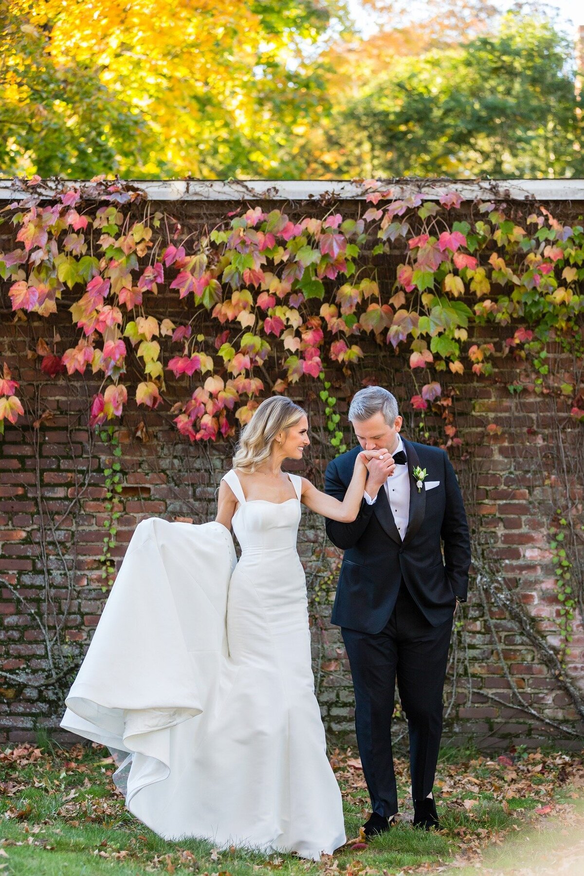 groom-kissing-bride-hand-new-haven-lawn-club