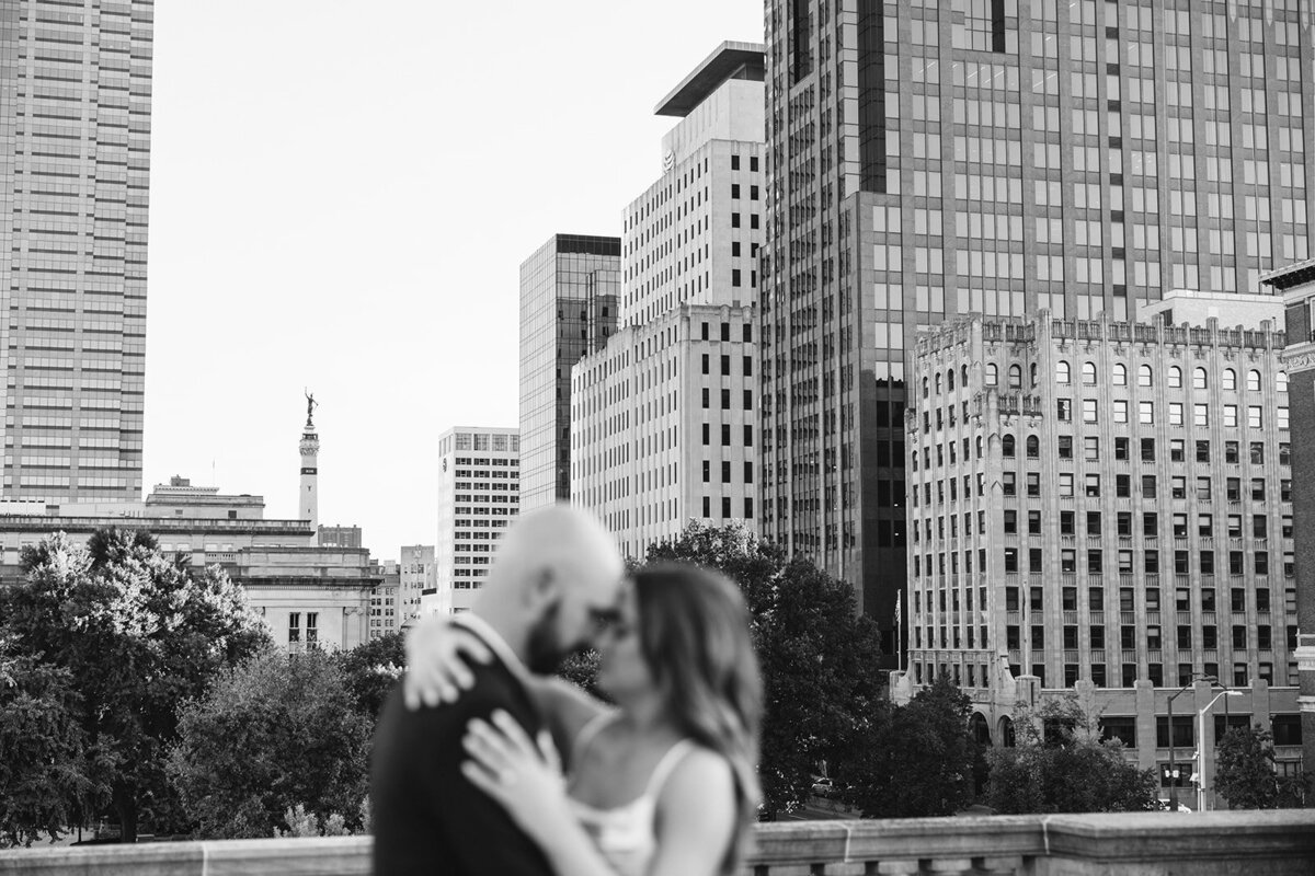 Engagement photographer Indianapolis skyline candid moment