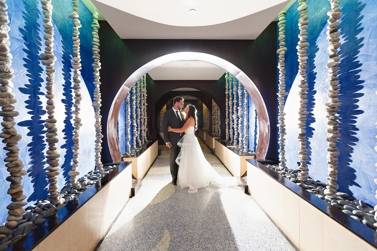 Bride and Groom Kiss in One Ocean Hallway After their Jacksonville Beach Wedding