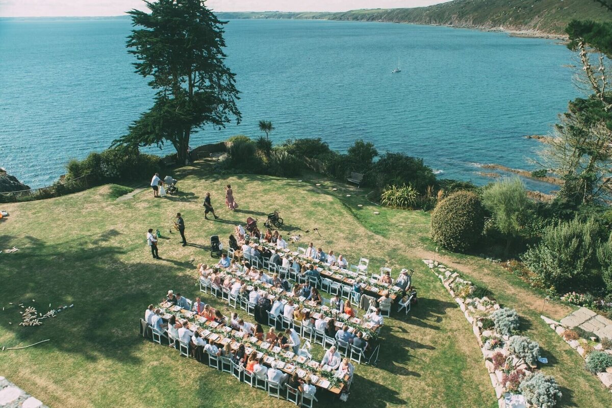 A beautiful dinner set up on the lawn at Polhawn Fort