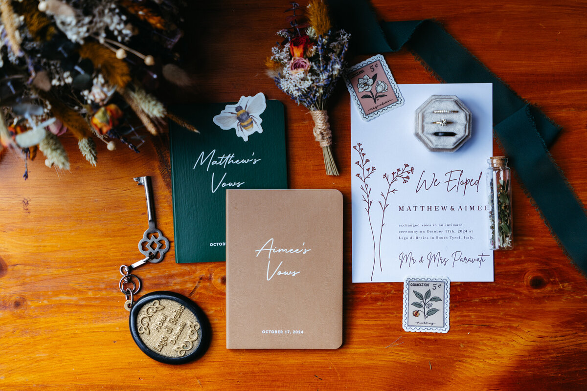 Flatlay with stationery, ribbons, and sentimental Dolomites elopement details