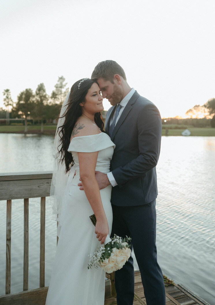 bride and groom holding each other during wedding