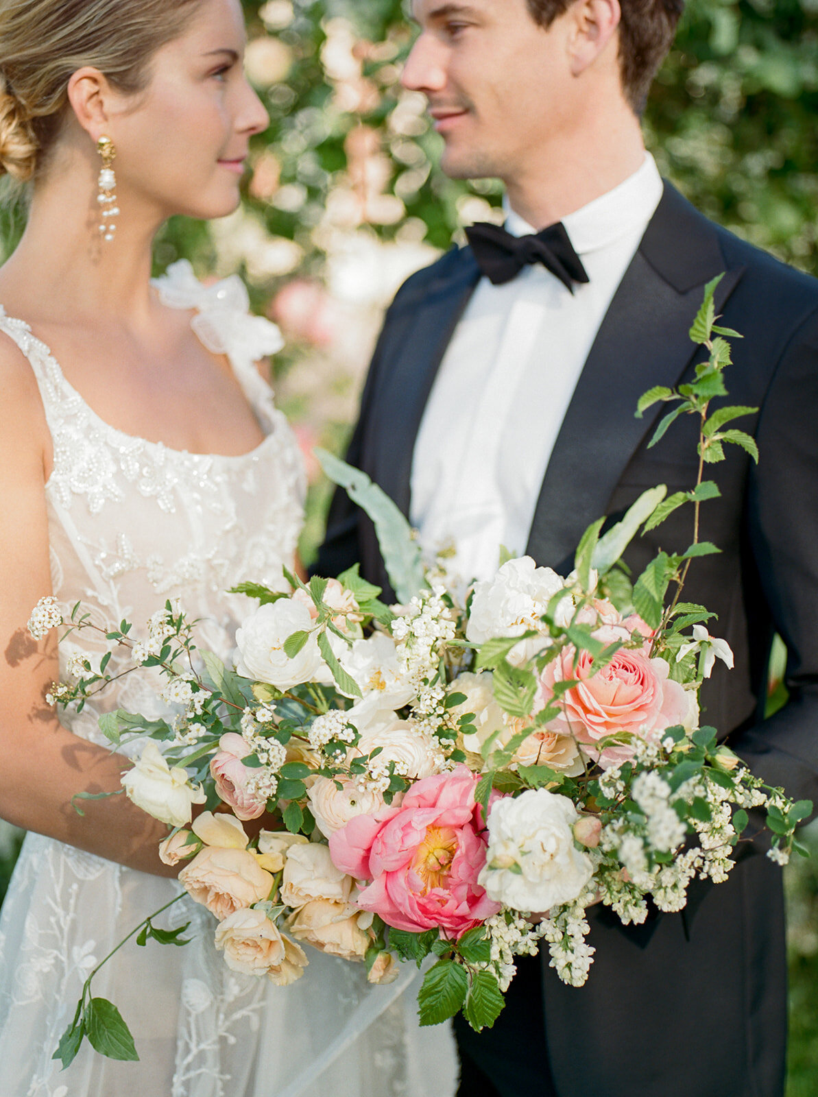 bride and groom with flower bouquet