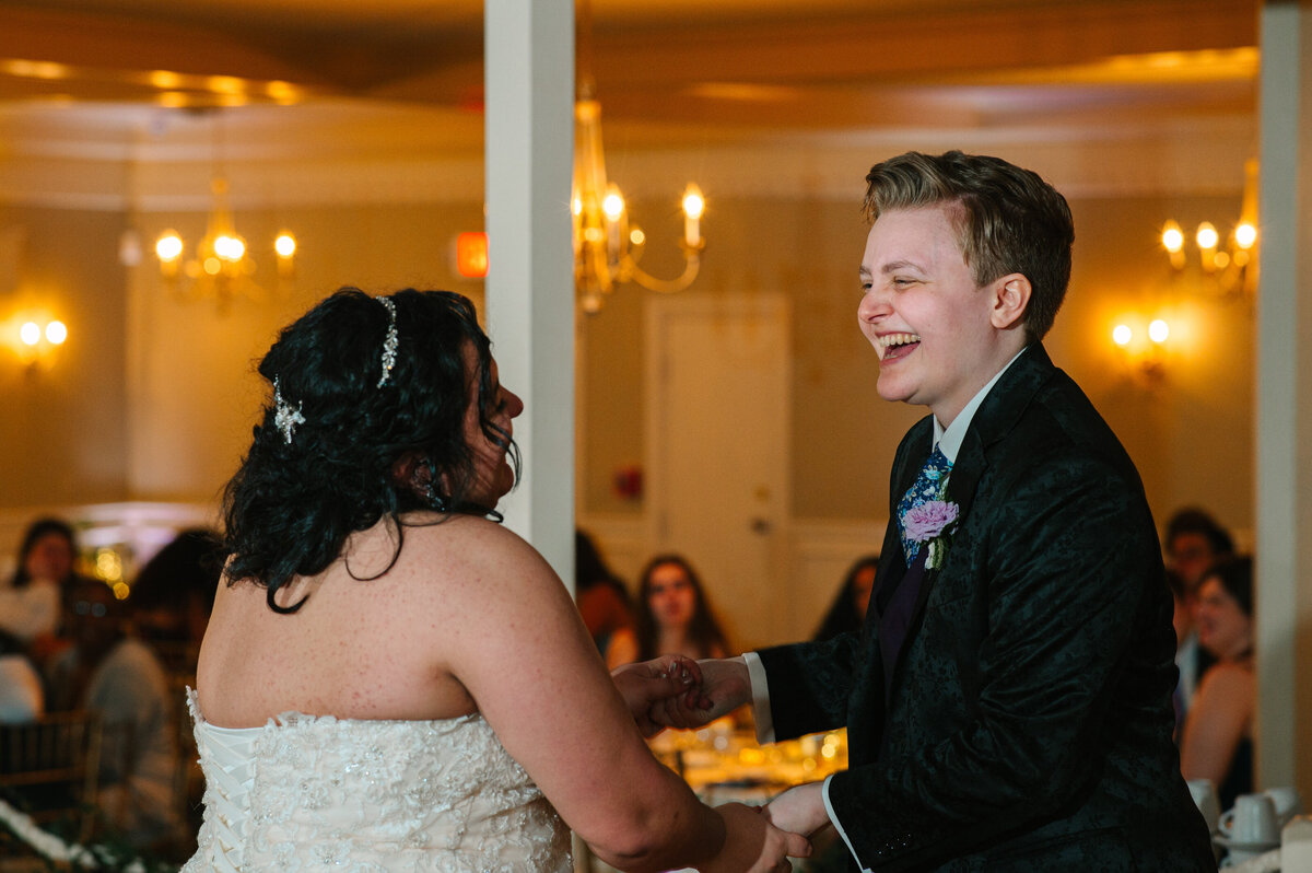 Brides laughing on the dance floor