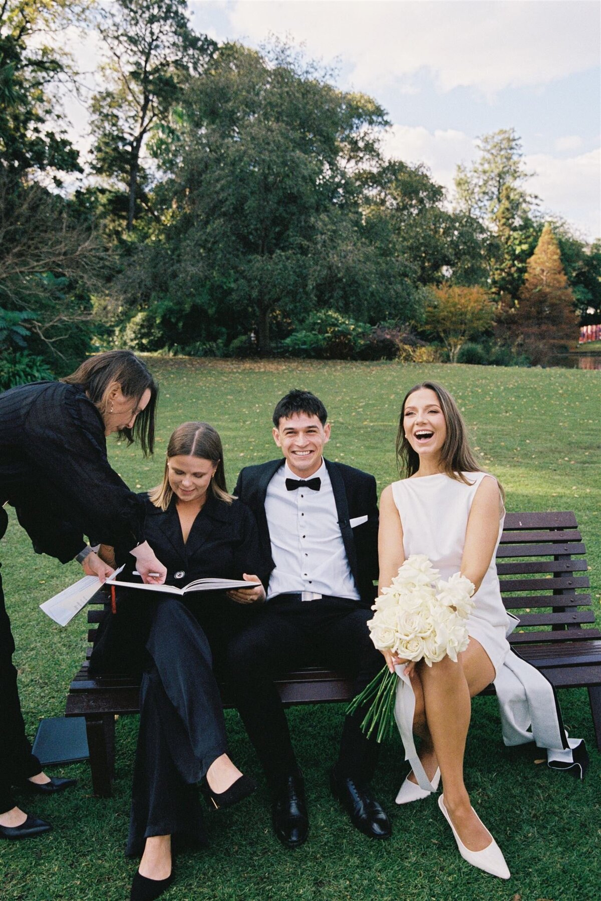 couple signing papers at royal botanic gardens wedding melbourne on 35mm film