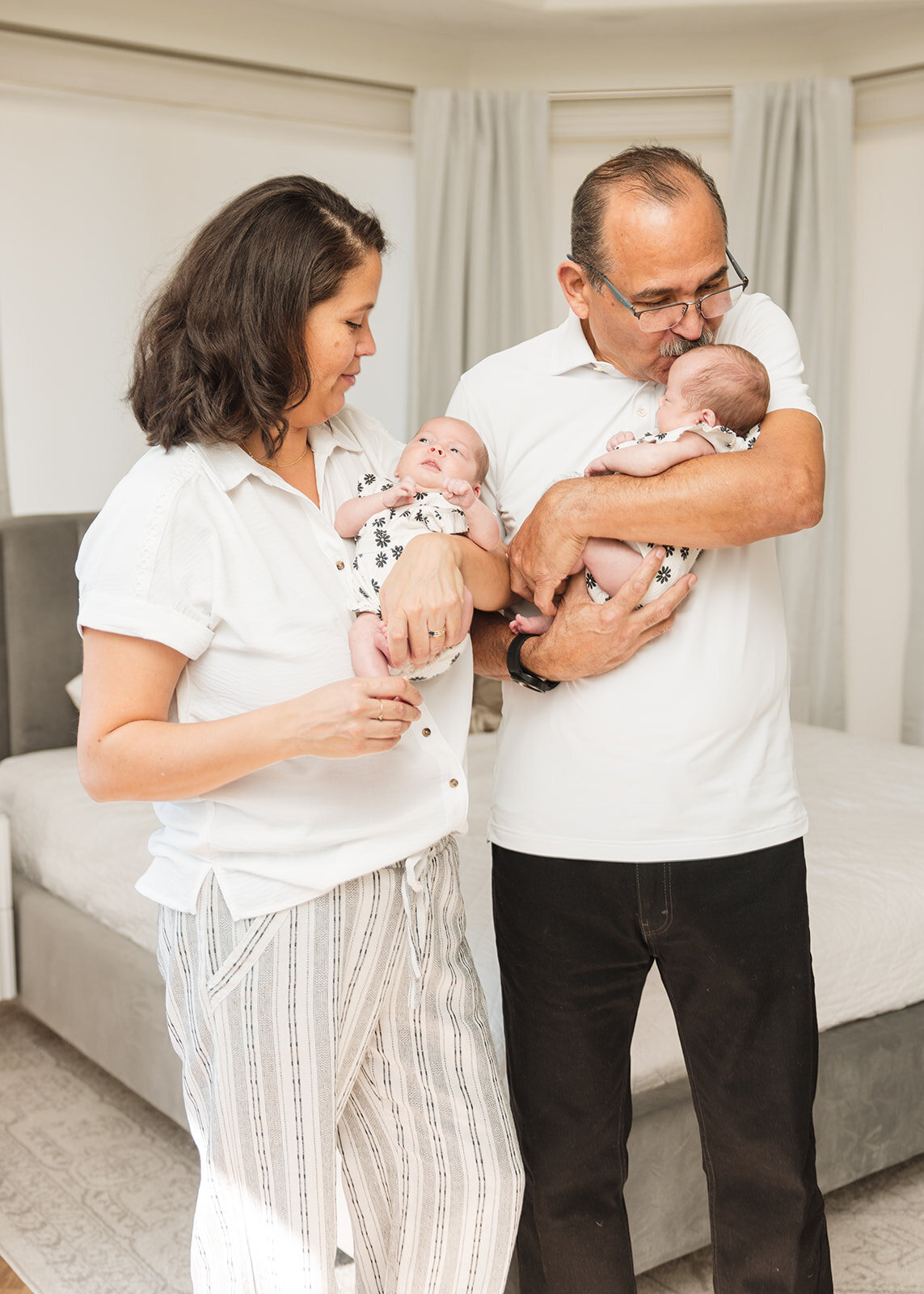 In-home lifestyle family session with mom, dad, toddler, and newborn in Orlando Florida home


