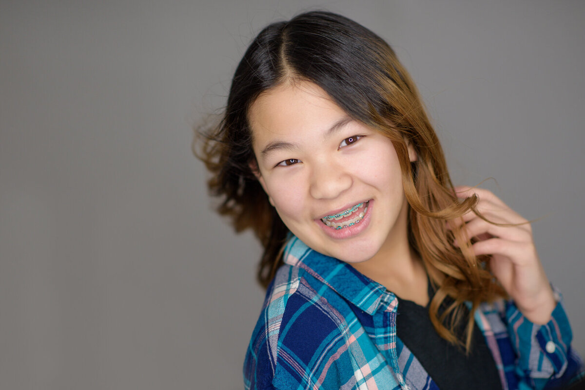 Tween girl smiling in photo studio in Boise.