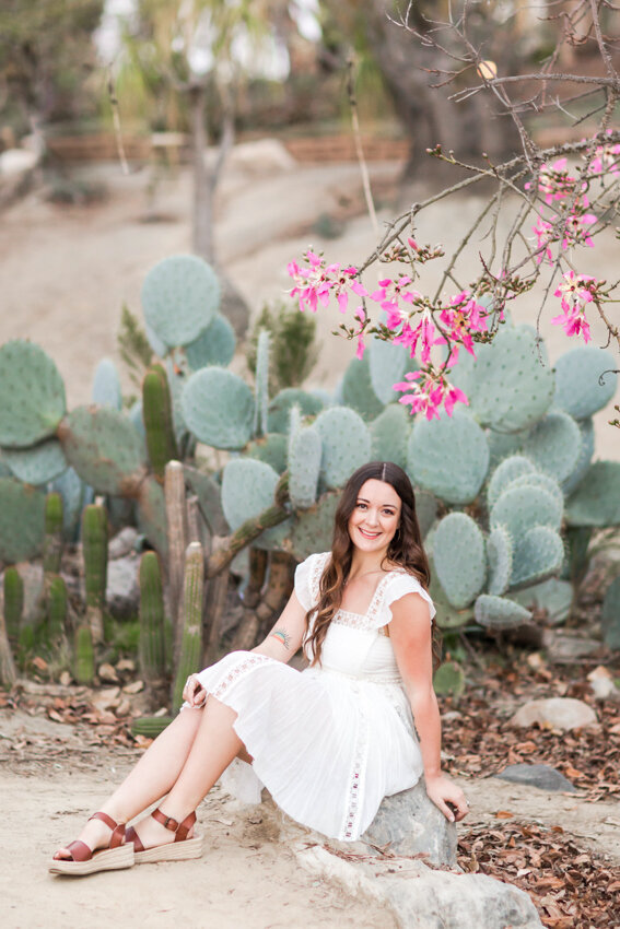 senior girl sitting in cactus garden balboa park san diego