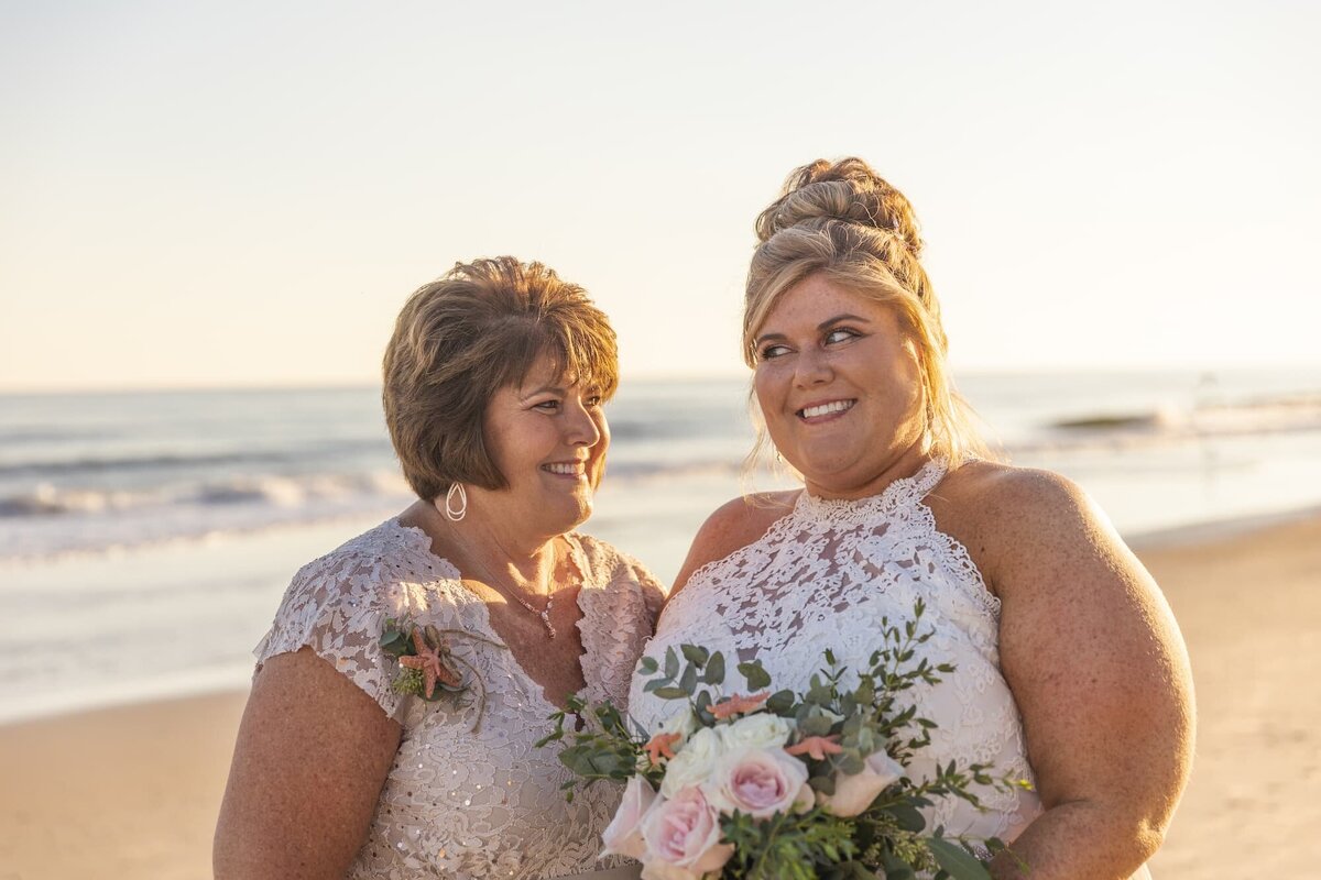 lgbtqia+ beach wedding mom and daughter
