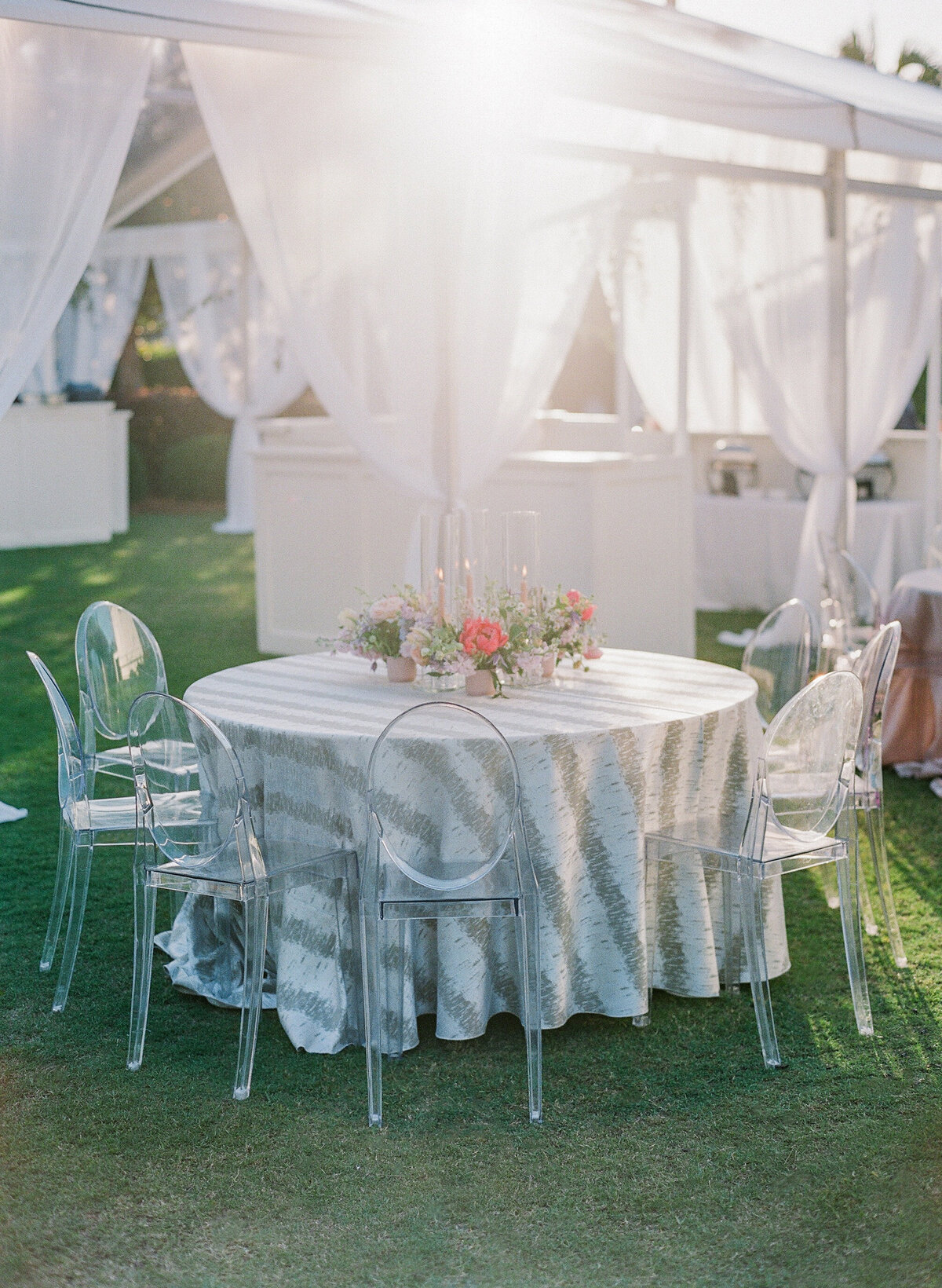 striped-tablecloth-ghost-chairs-luxury-wedding-30a