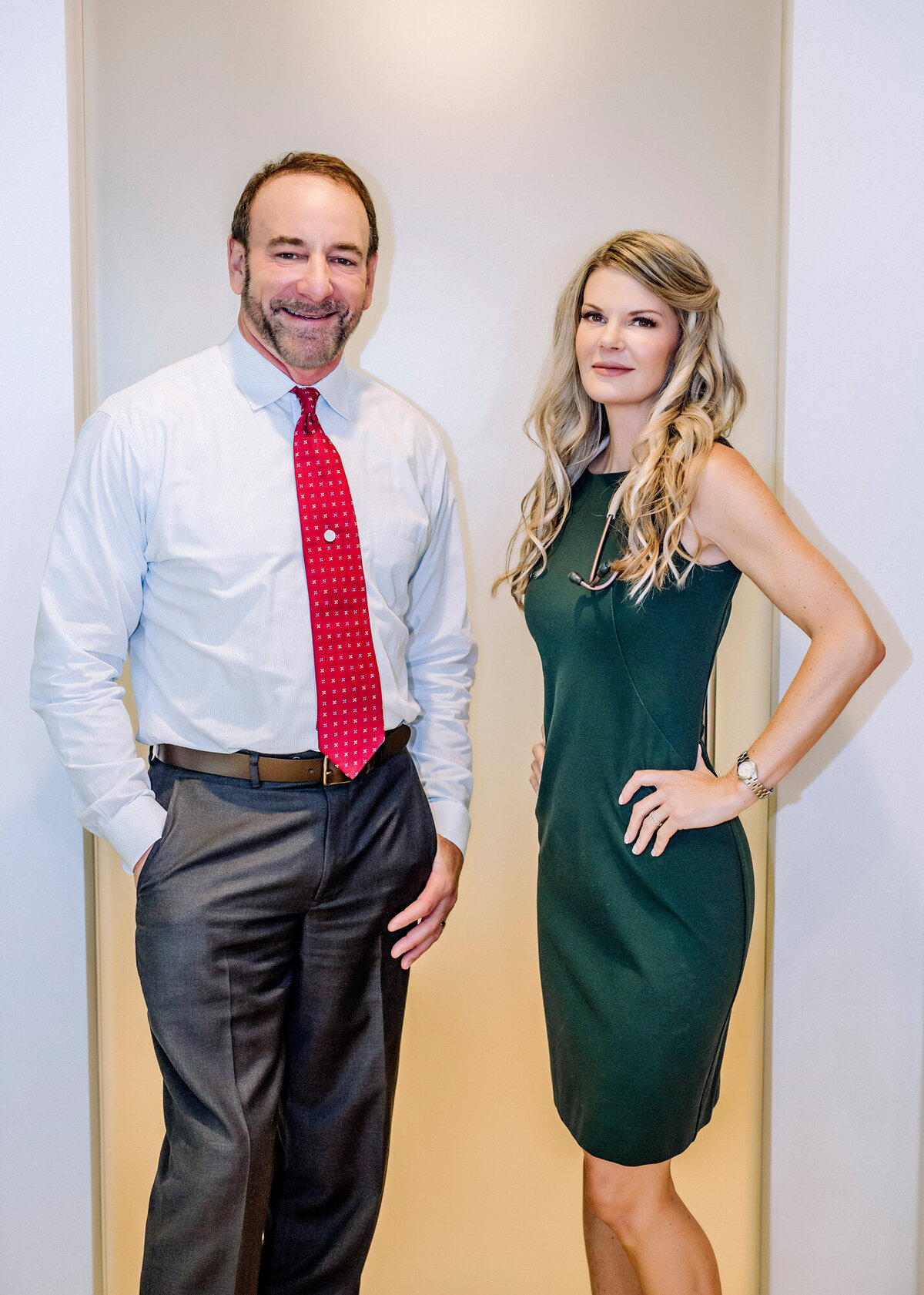 A husband and wife, Physician & NP who co-own a business together posing for a South Shore MA branding photographer