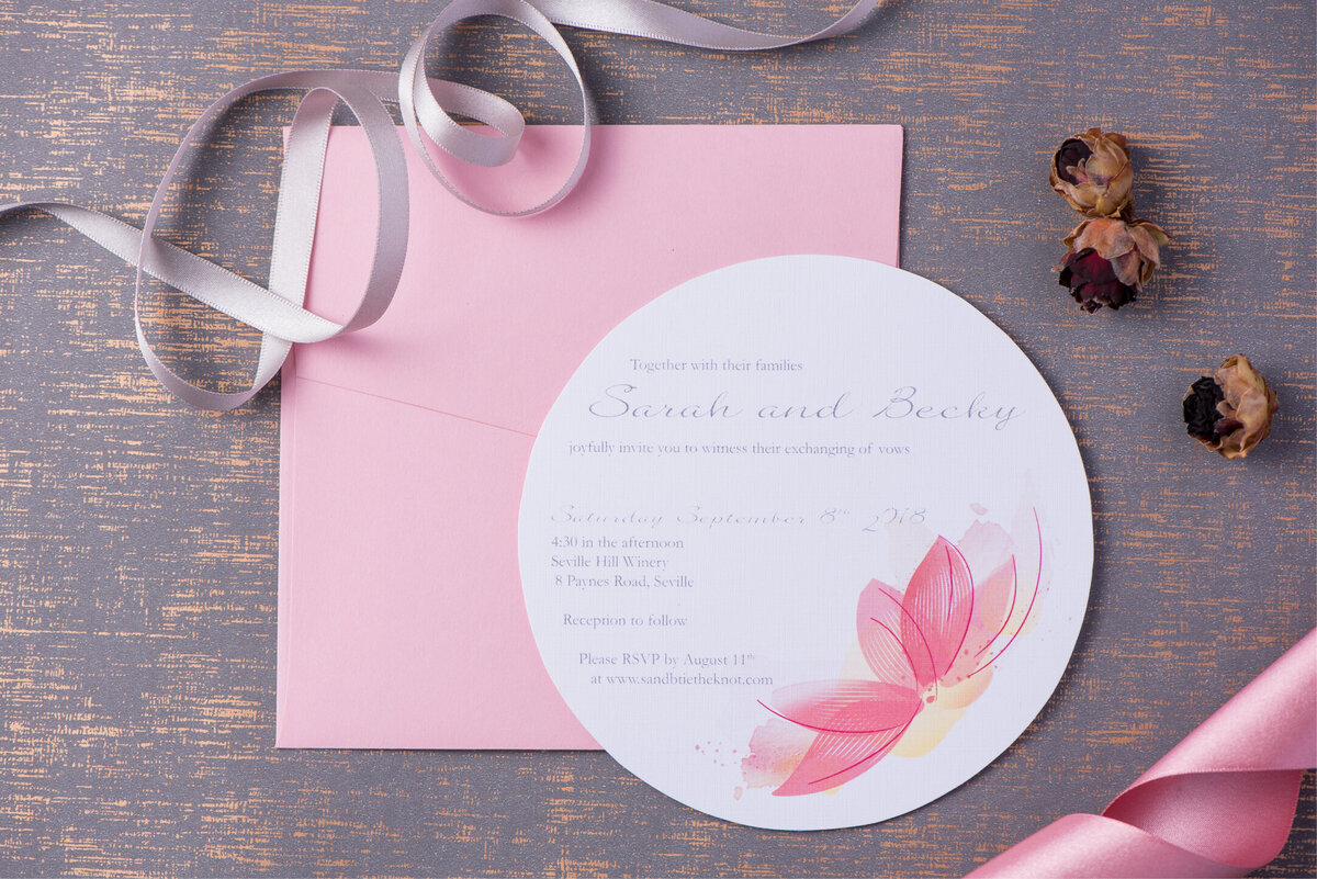 Round circle pink wedding invitation with soft floral design