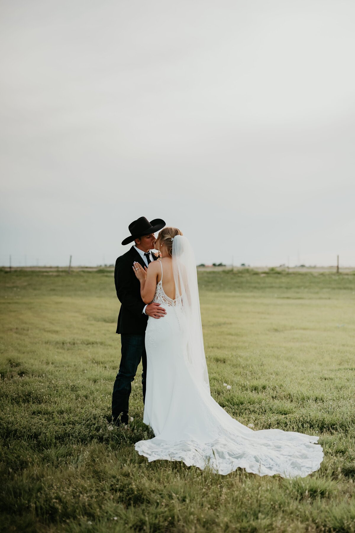 country couple standing in field, bride and groom, amarillo texas wedding photography,, Emily wheeler photography