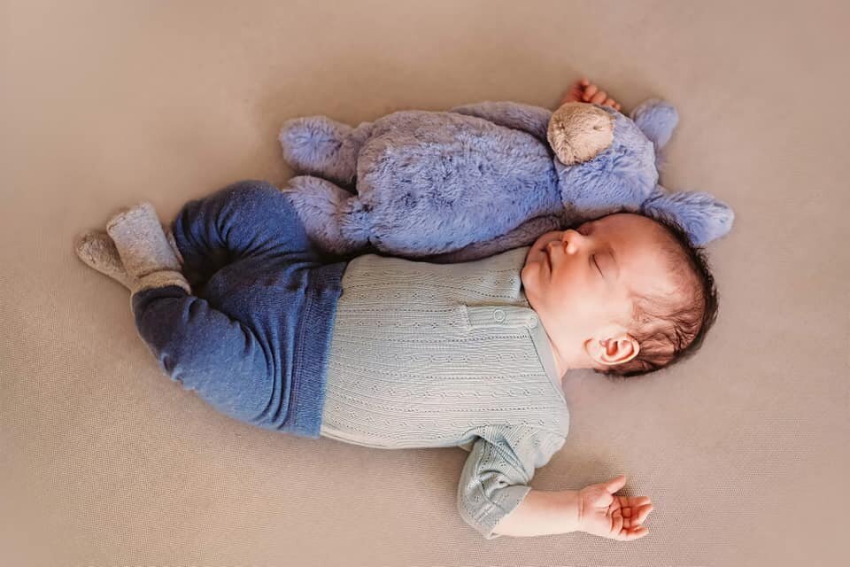 newborn and teddy bear