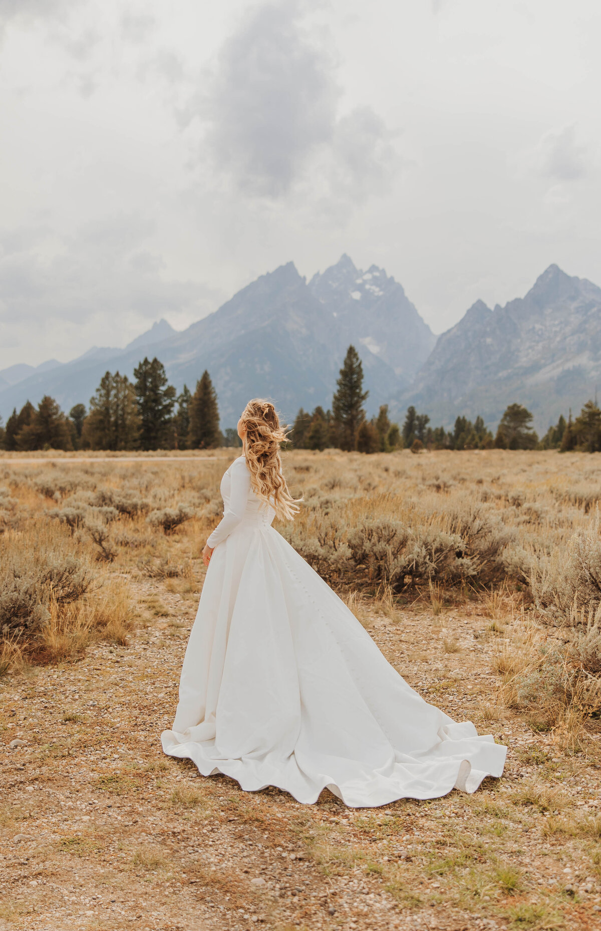 bride posing in field