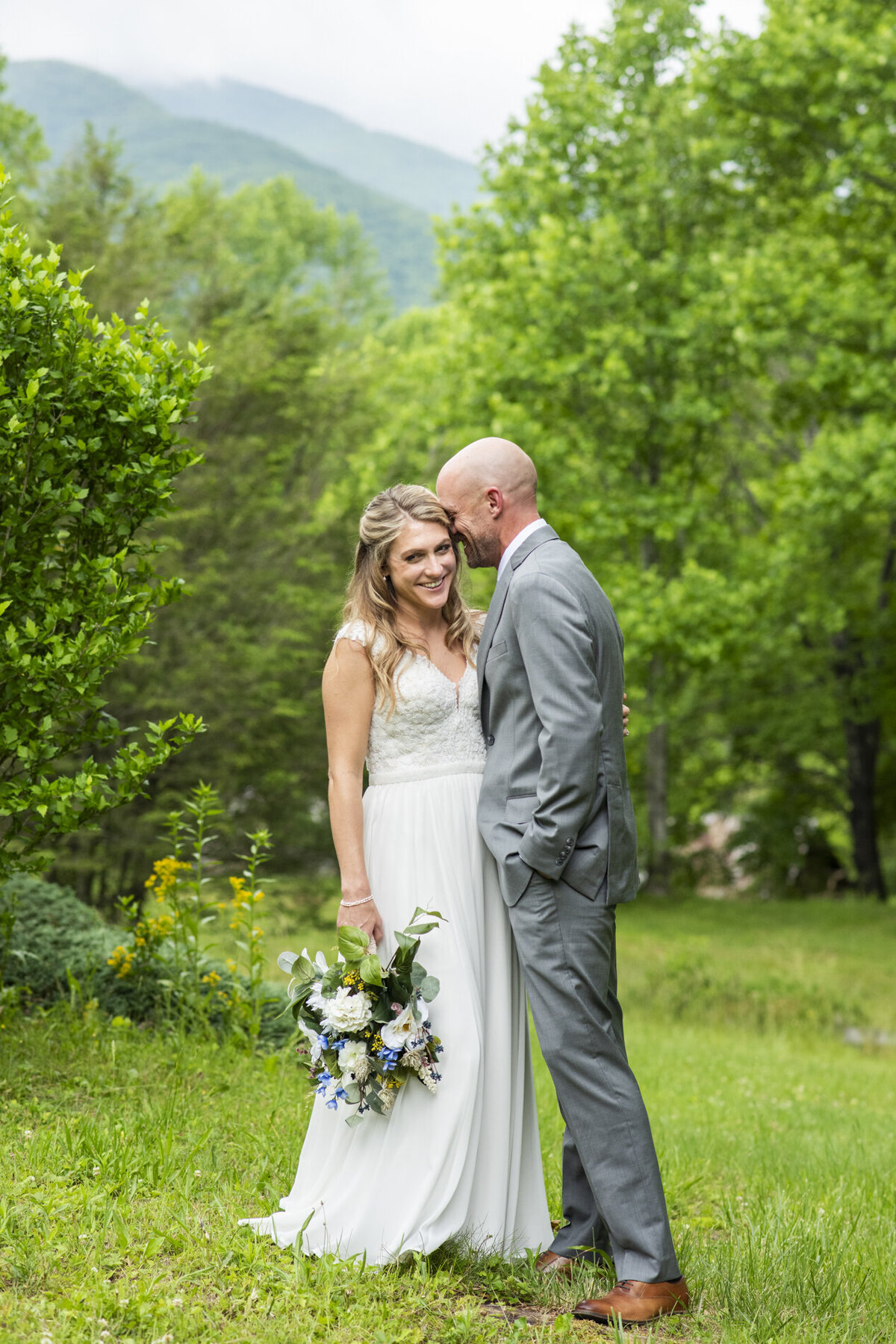 Wedding couple snuggling at Mount Mitchell Eco Retreat