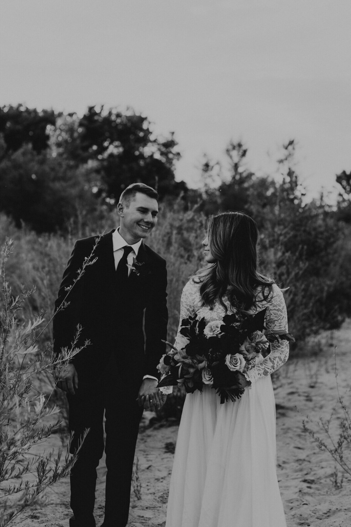 newlyweds walking and laughing